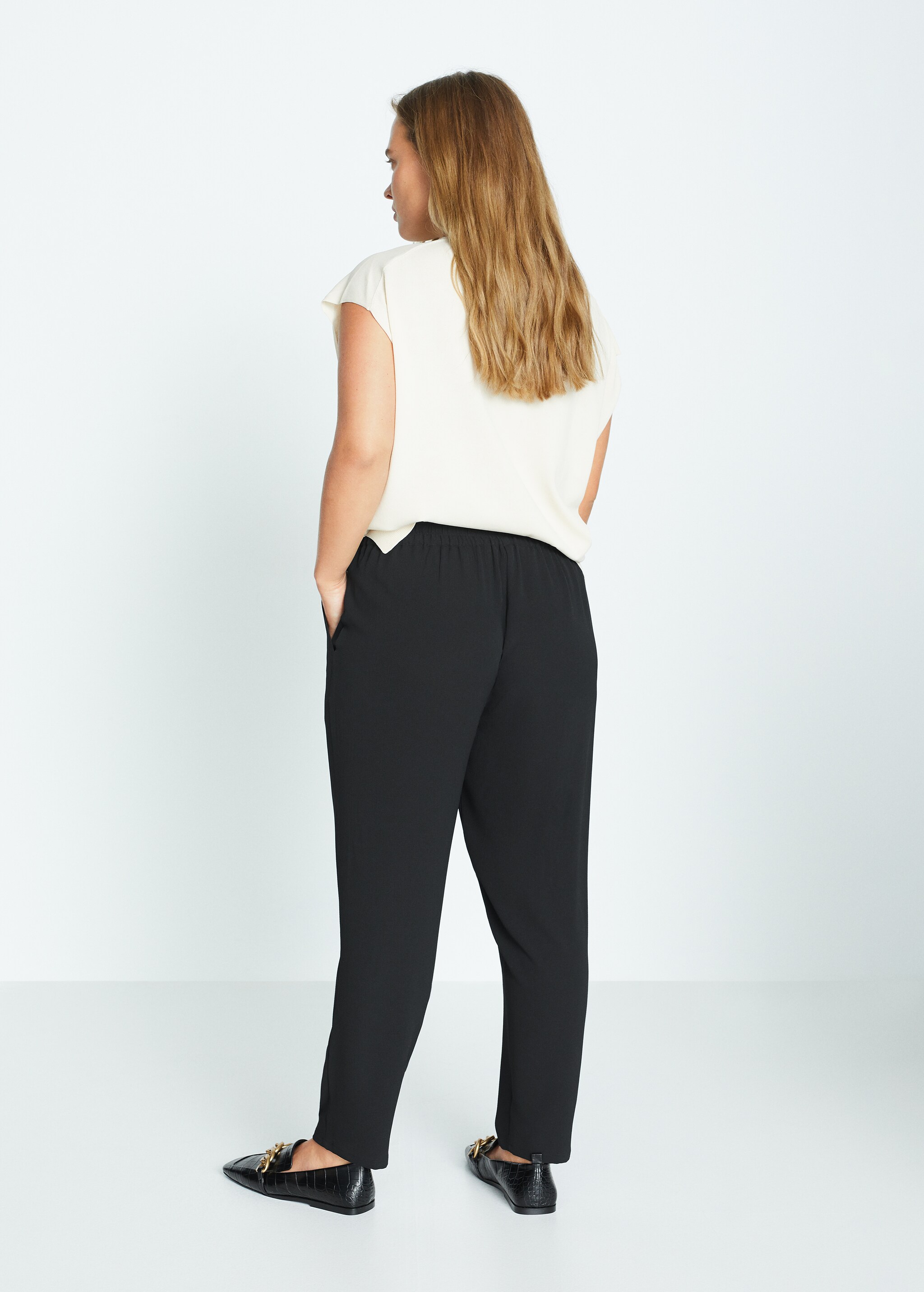 Drawstring baggy trousers - Reverse of the article