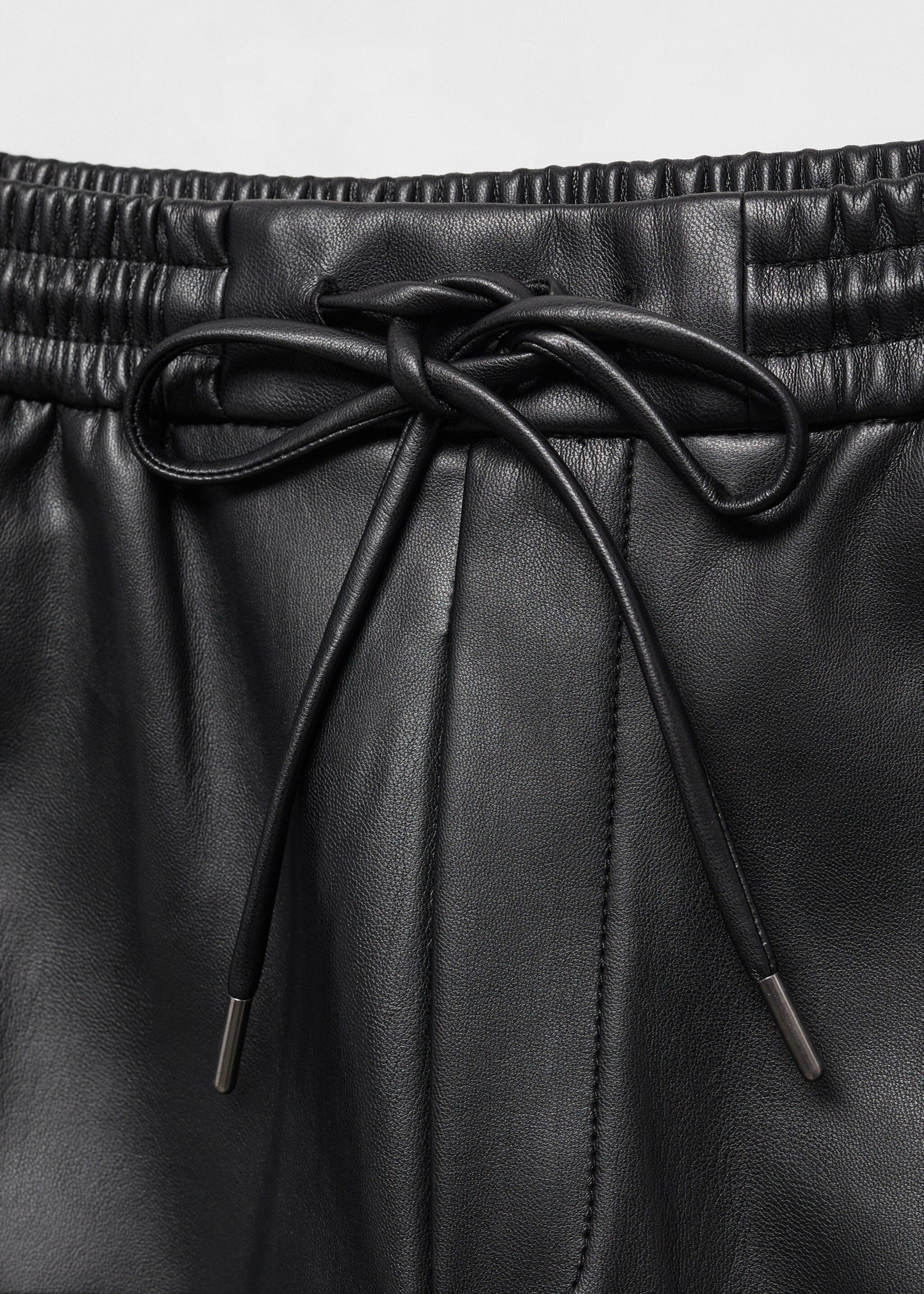 Leather-effect elastic waist trousers - Details of the article 8
