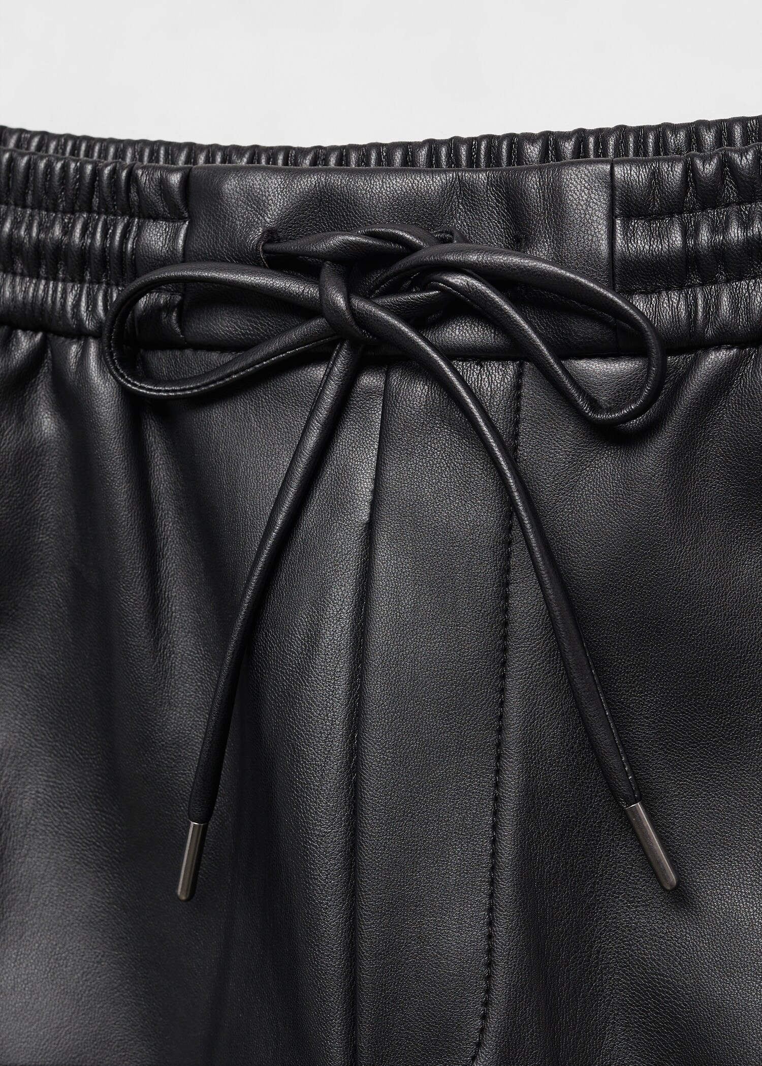 Leather-effect elastic waist trousers - Details of the article 8