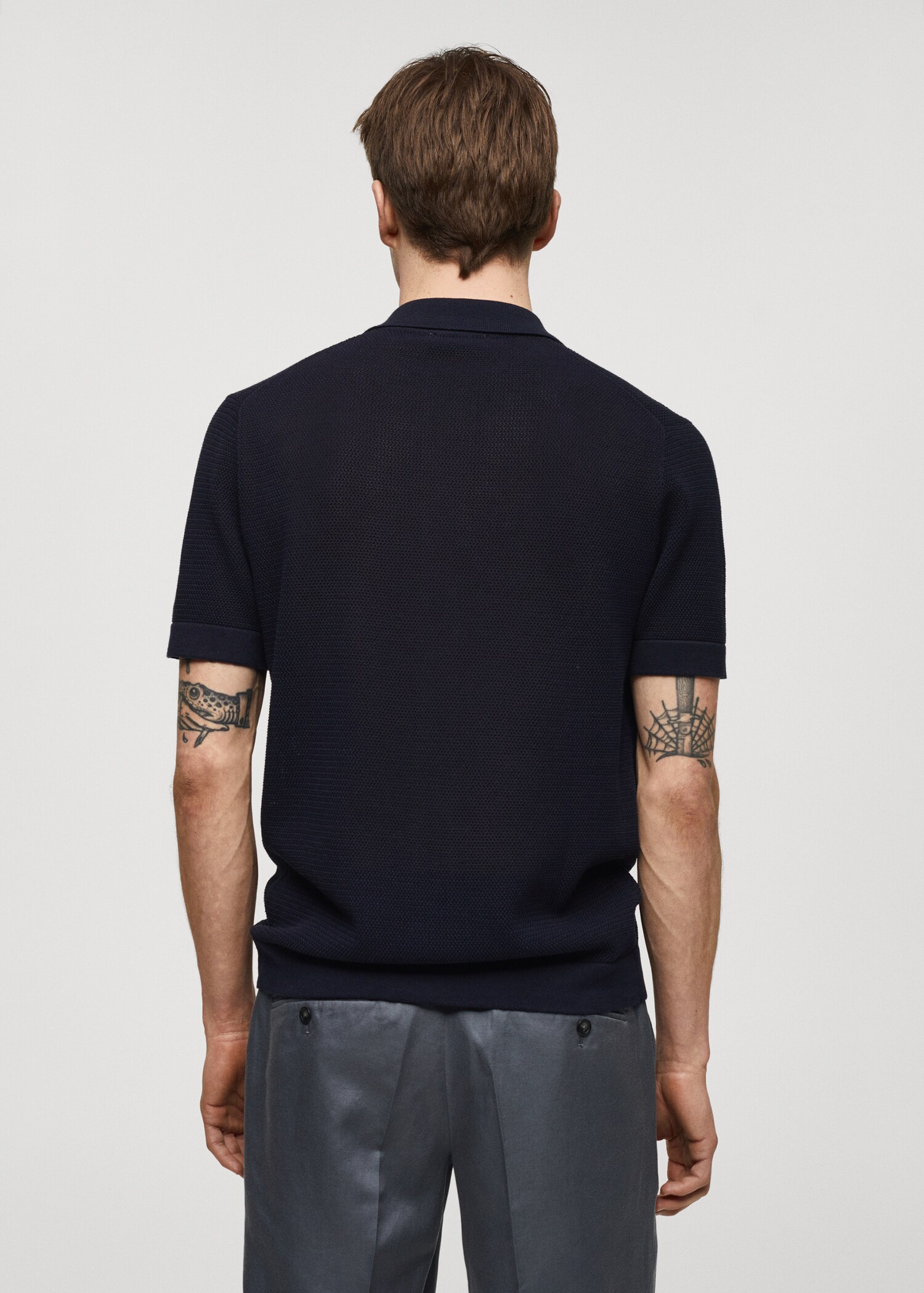 Structured knitted polo shirt with buttons - Reverse of the article