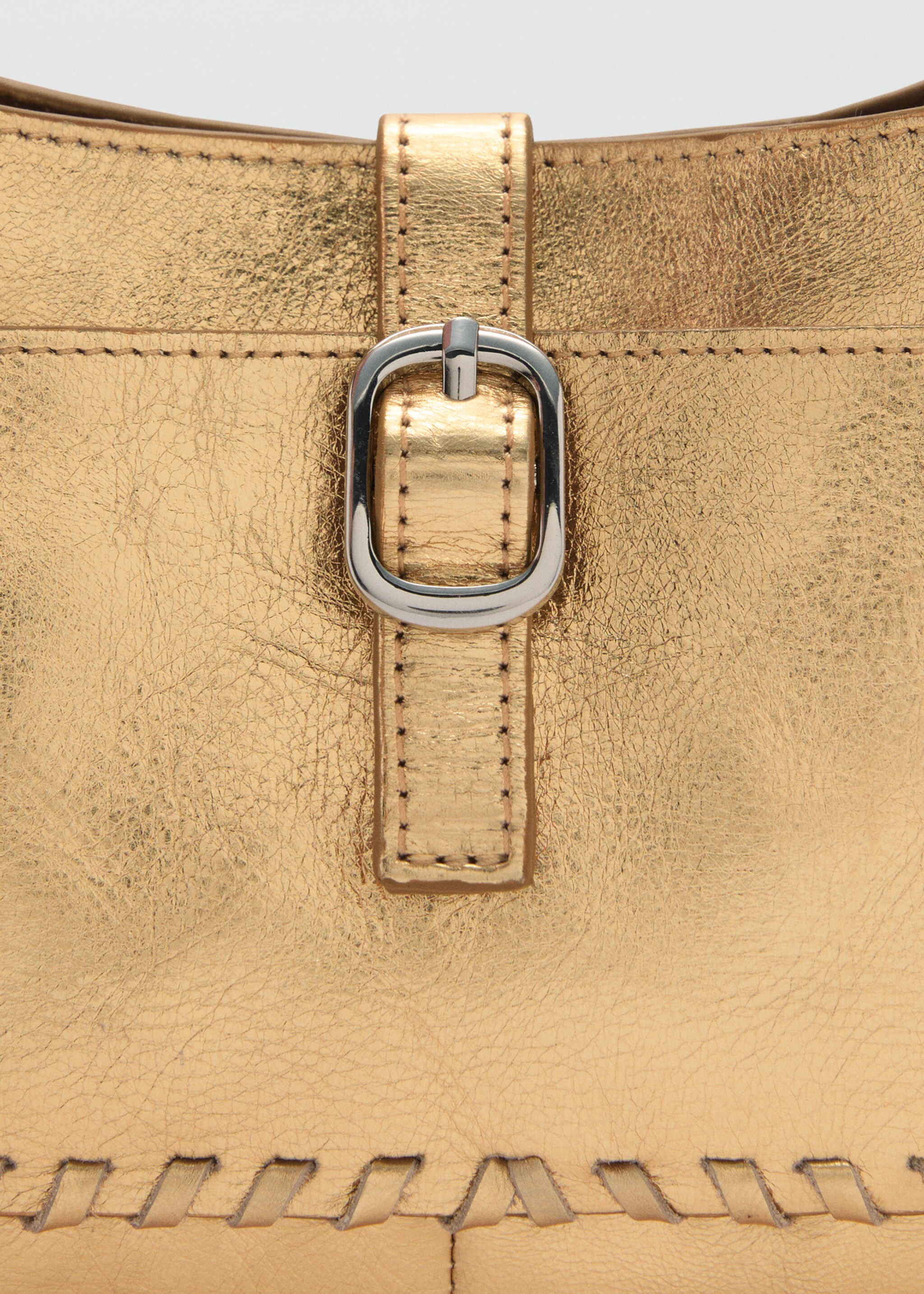 Bossa pell metal·litzada - Detall de l'article 1, Daurat. Ref: 77002013-00.