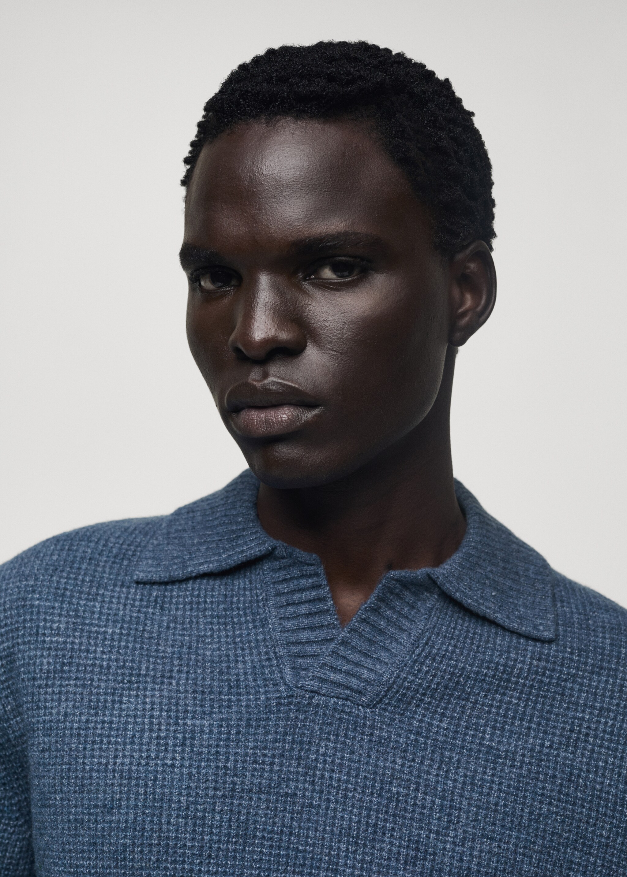 Knitted structured check polo sweater - Details of the article 1, China Blue. Ref: 77007952-00.