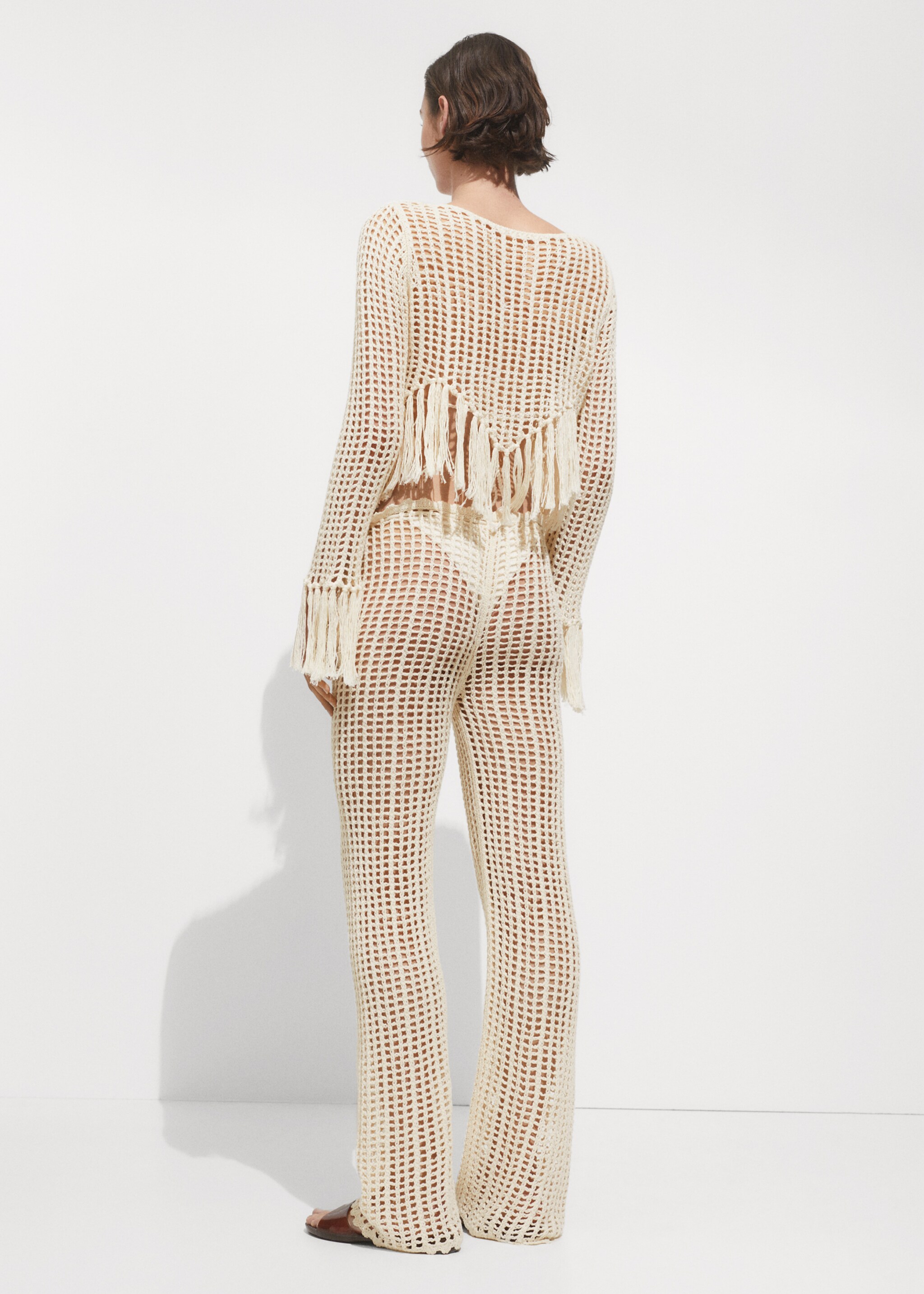 Openwork knitted trousers - Reverse of the article
