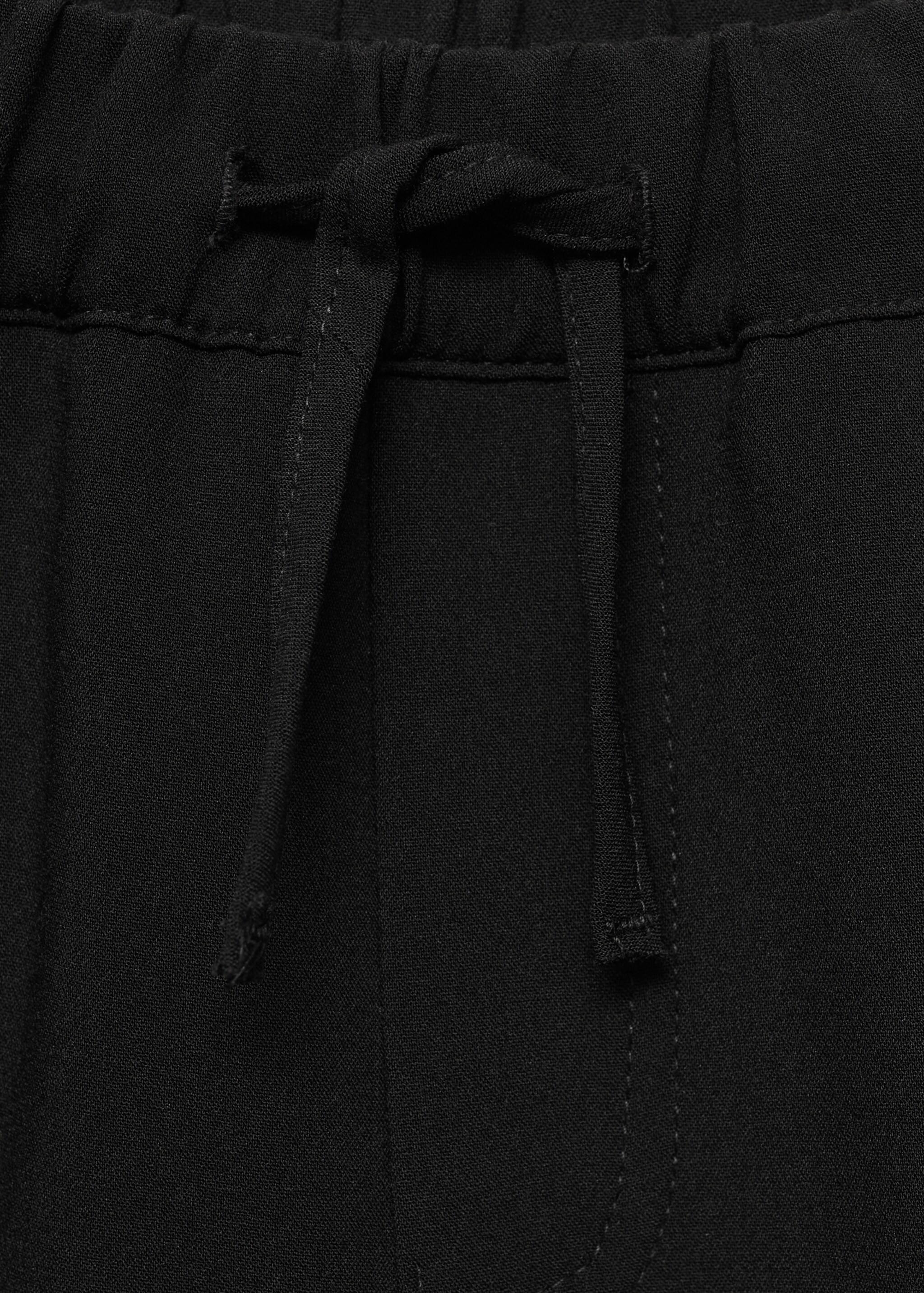Flowy cargo trousers - Details of the article 8, Black. Ref: 77016735-00.