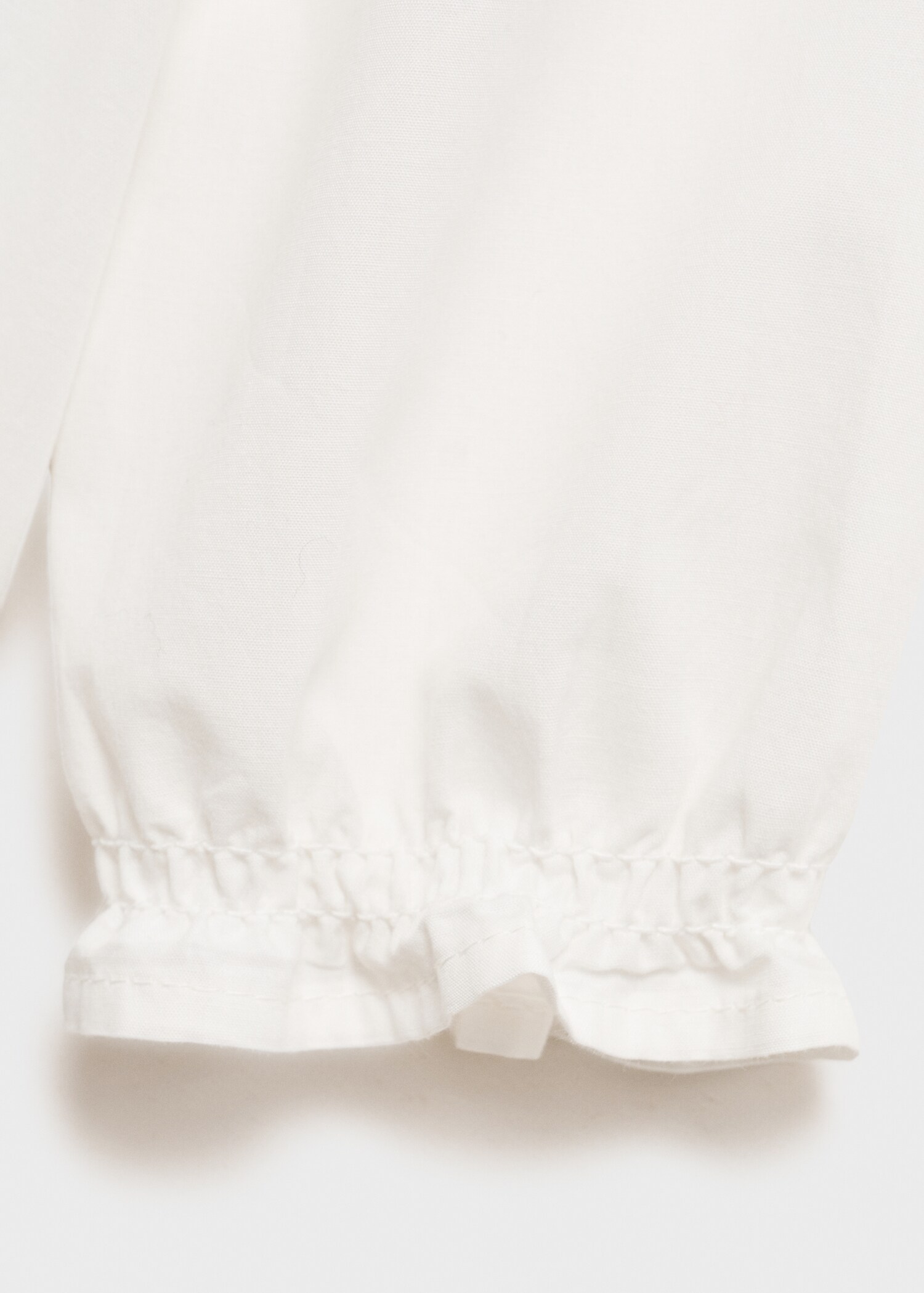 Bestickte Bluse mit Babydoll-Kragen - Detail des Artikels 8