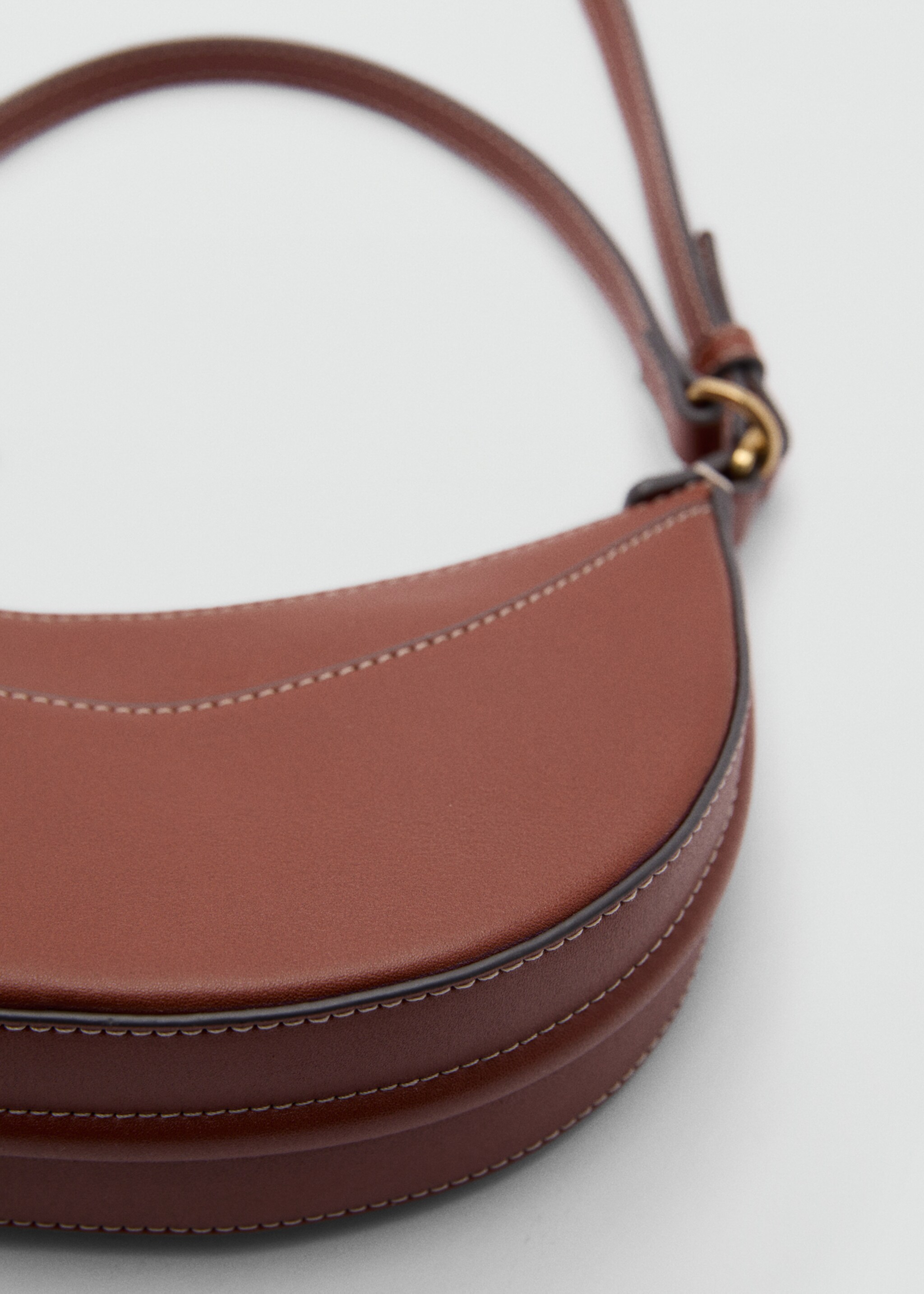 Oval shoulder bag - Details of the article 1, Leather. Ref: 77020328-00.