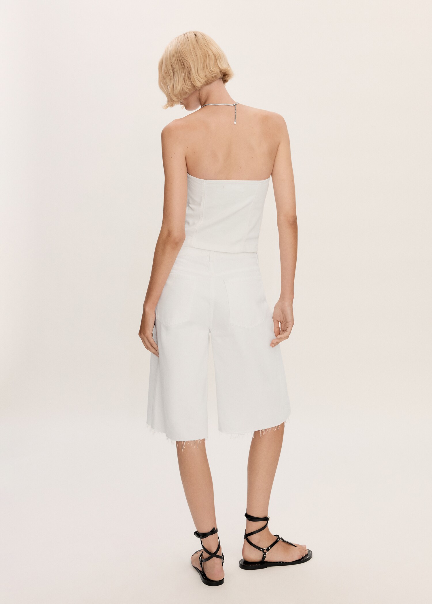 Oversized denim bermuda shorts - Reverse of the article