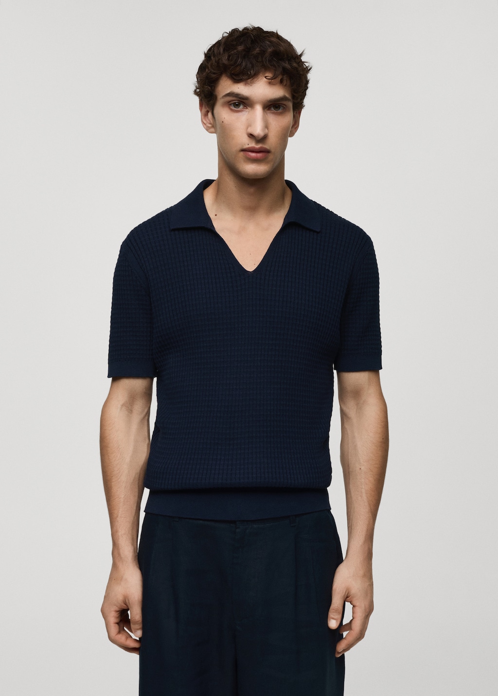 Ribbed knit polo shirt - Men | MANGO OUTLET USA
