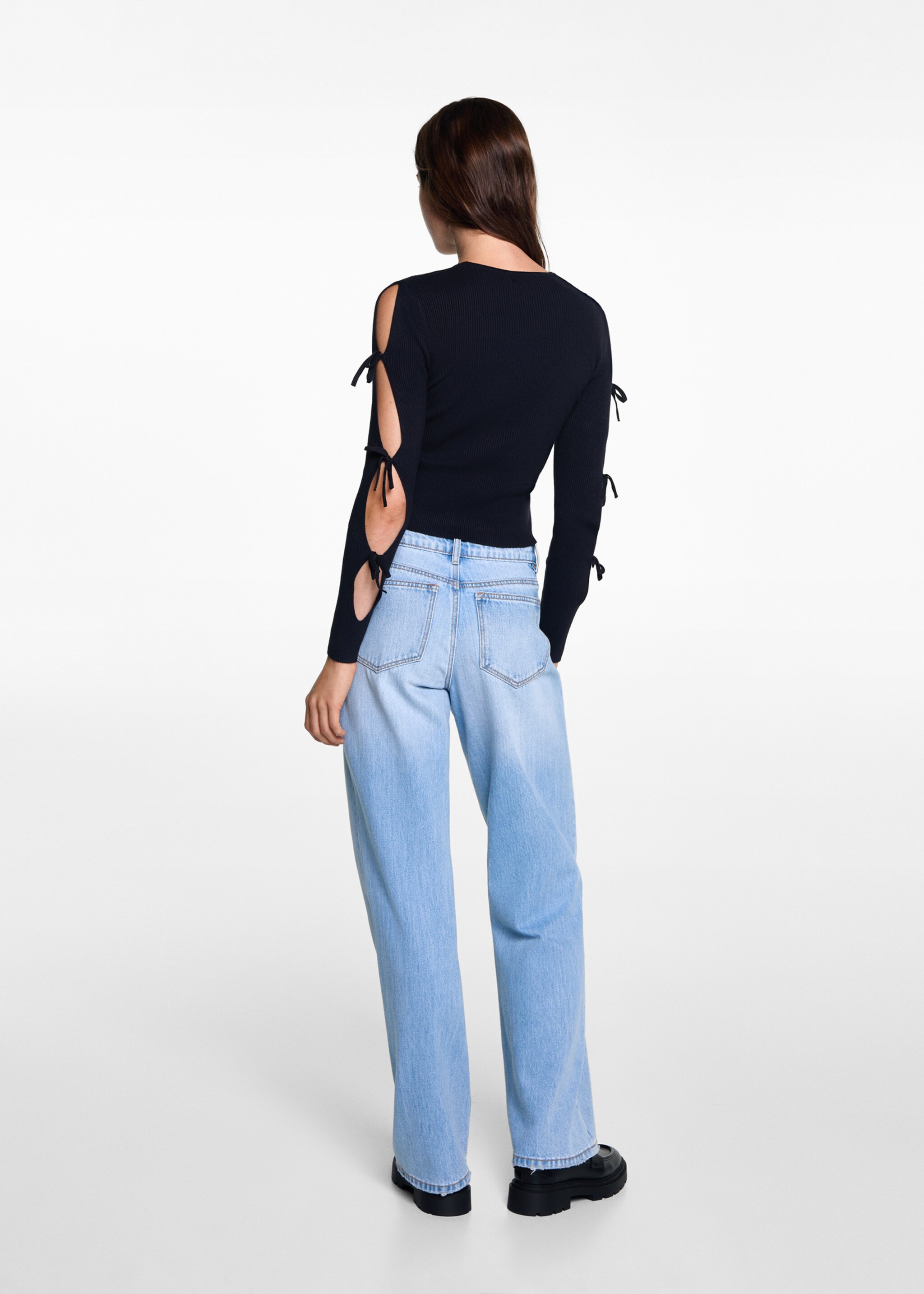 Sweater with bow openings - Reverse of the article