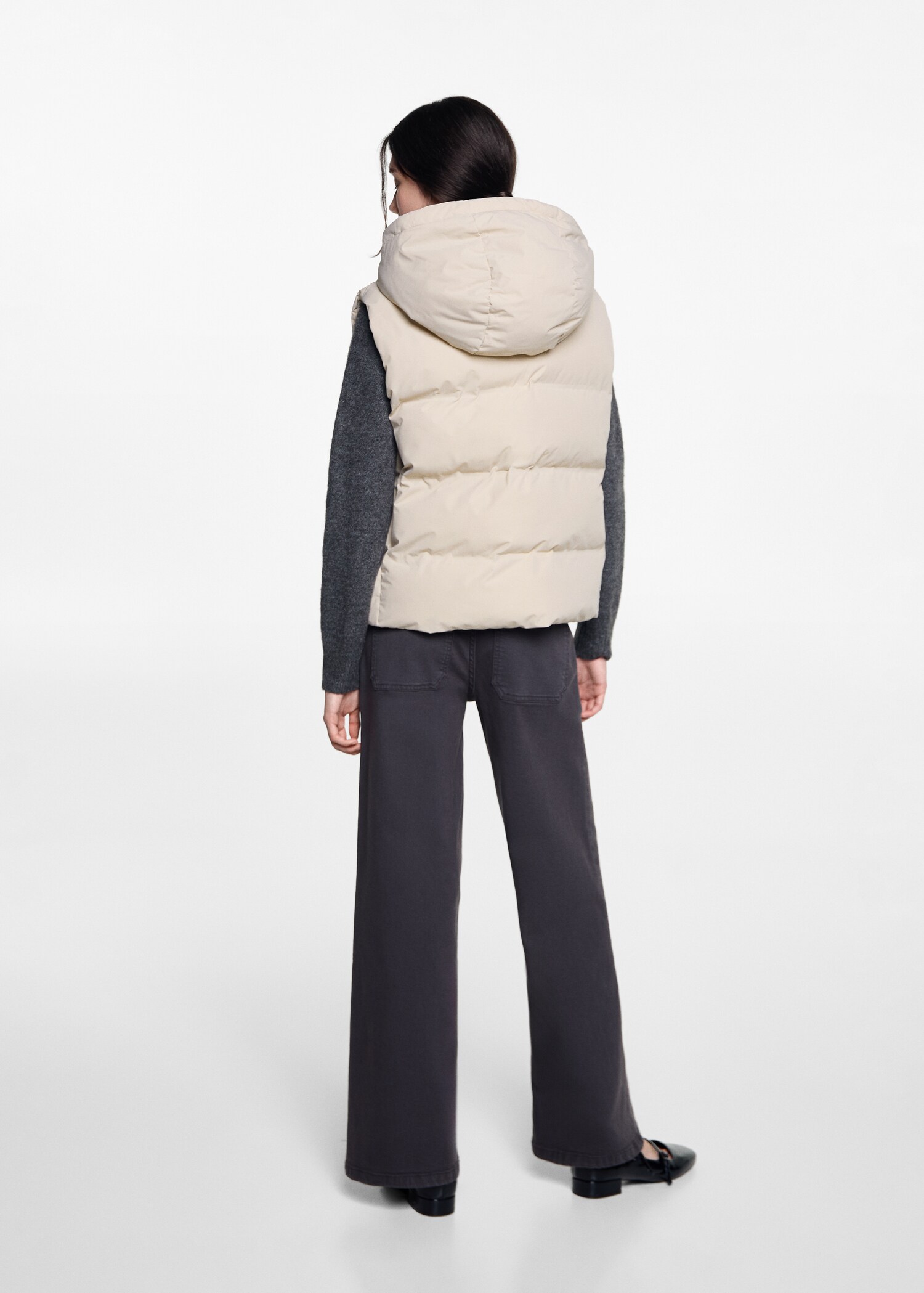 Quilted vest with hood - Reverse of the article