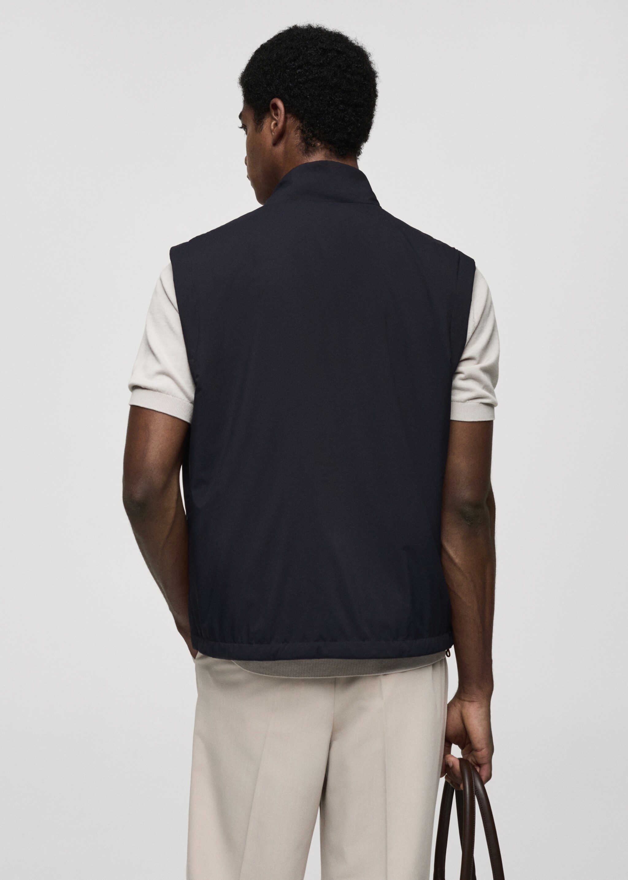 Waterafstotende reversibele bodywarmer - Achterkant van het artikel, Donkermarine. Ref: 77044433-00.