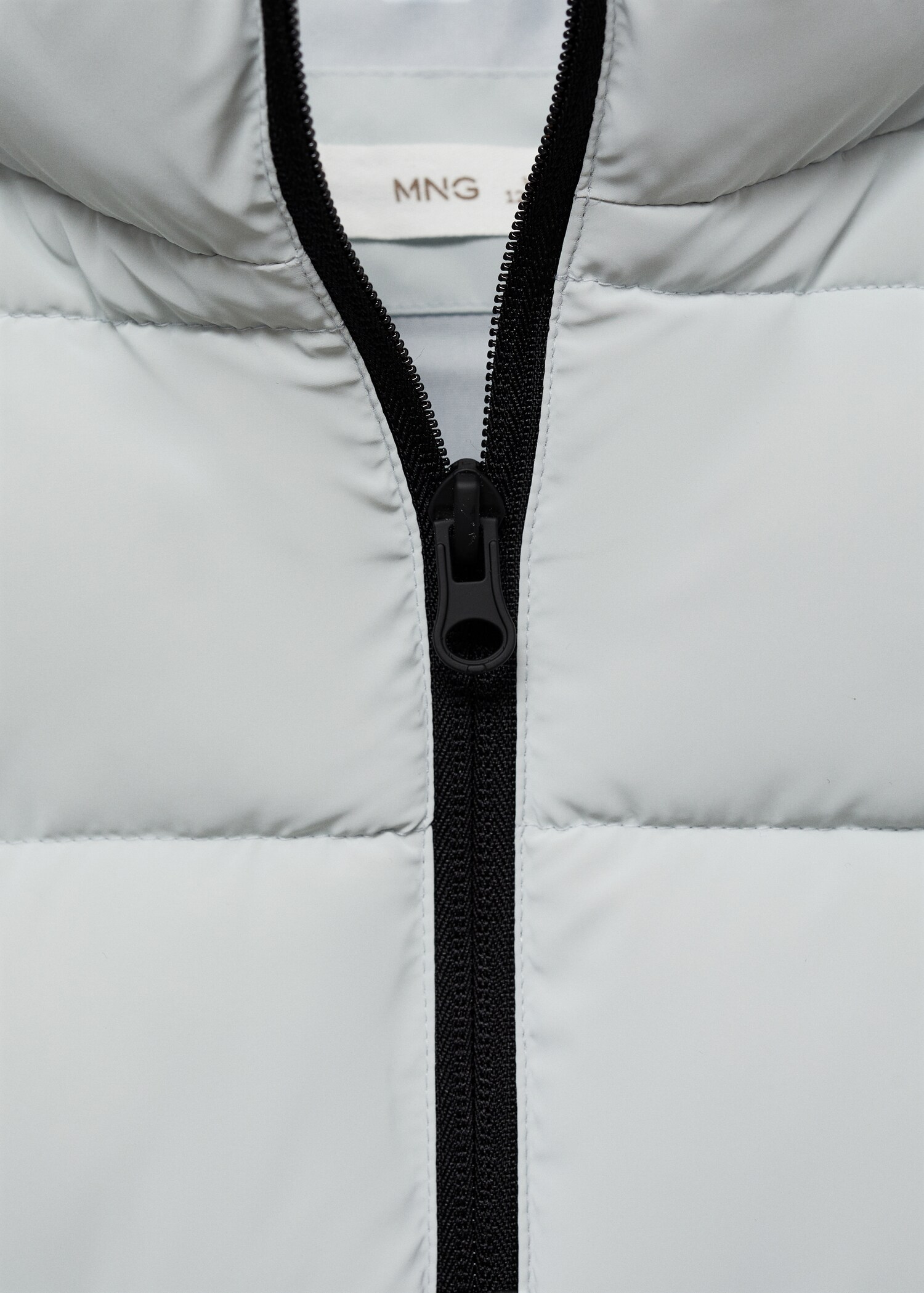 Bodywarmer - Detail van het artikel 8