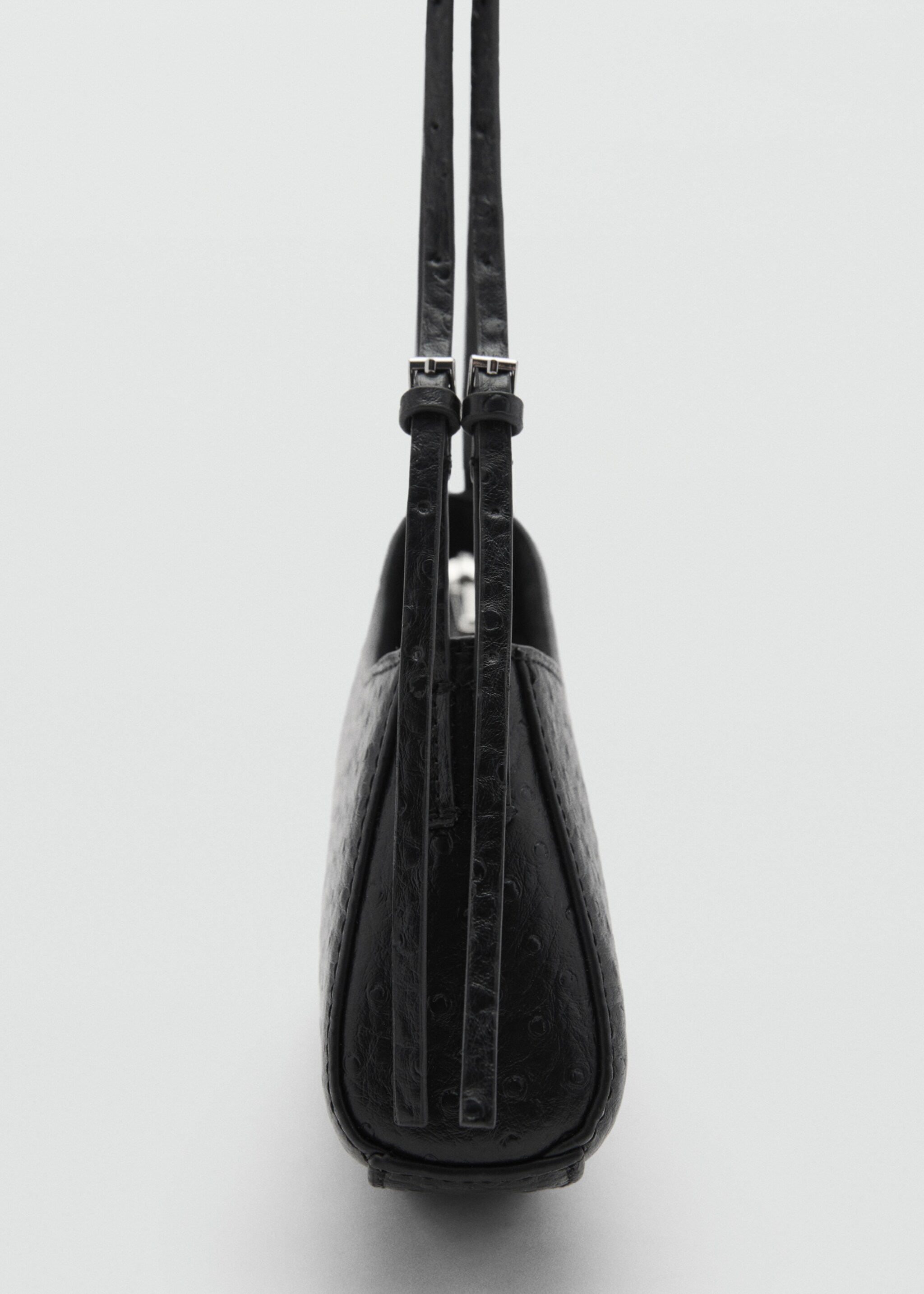Oval textured bag - Details of the article 1, Black. Ref: 77047933-00.