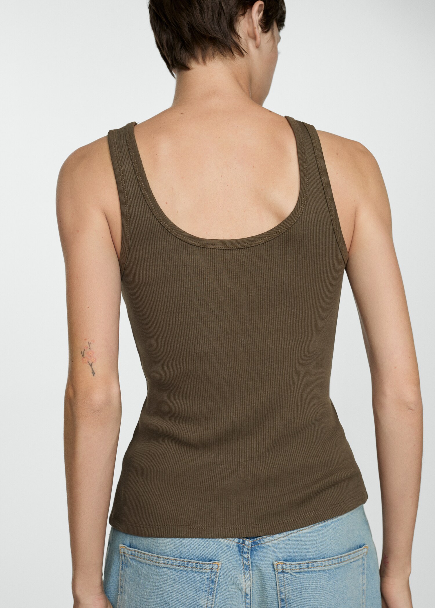Top with straps and buttons - Reverse of the article