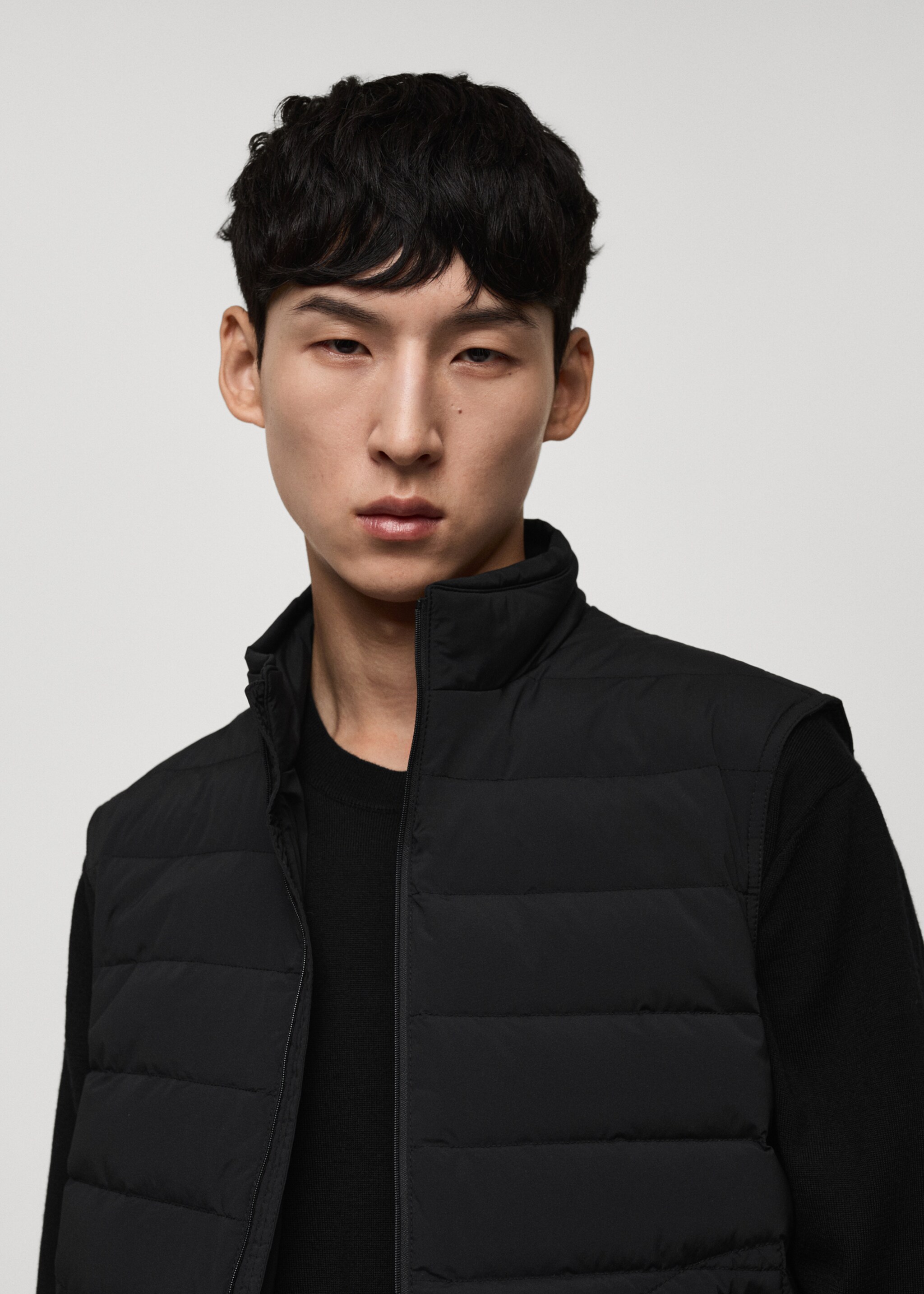 Quilted gilet with feather filling - Details of the article 1, Black. Ref: 77054432-00.
