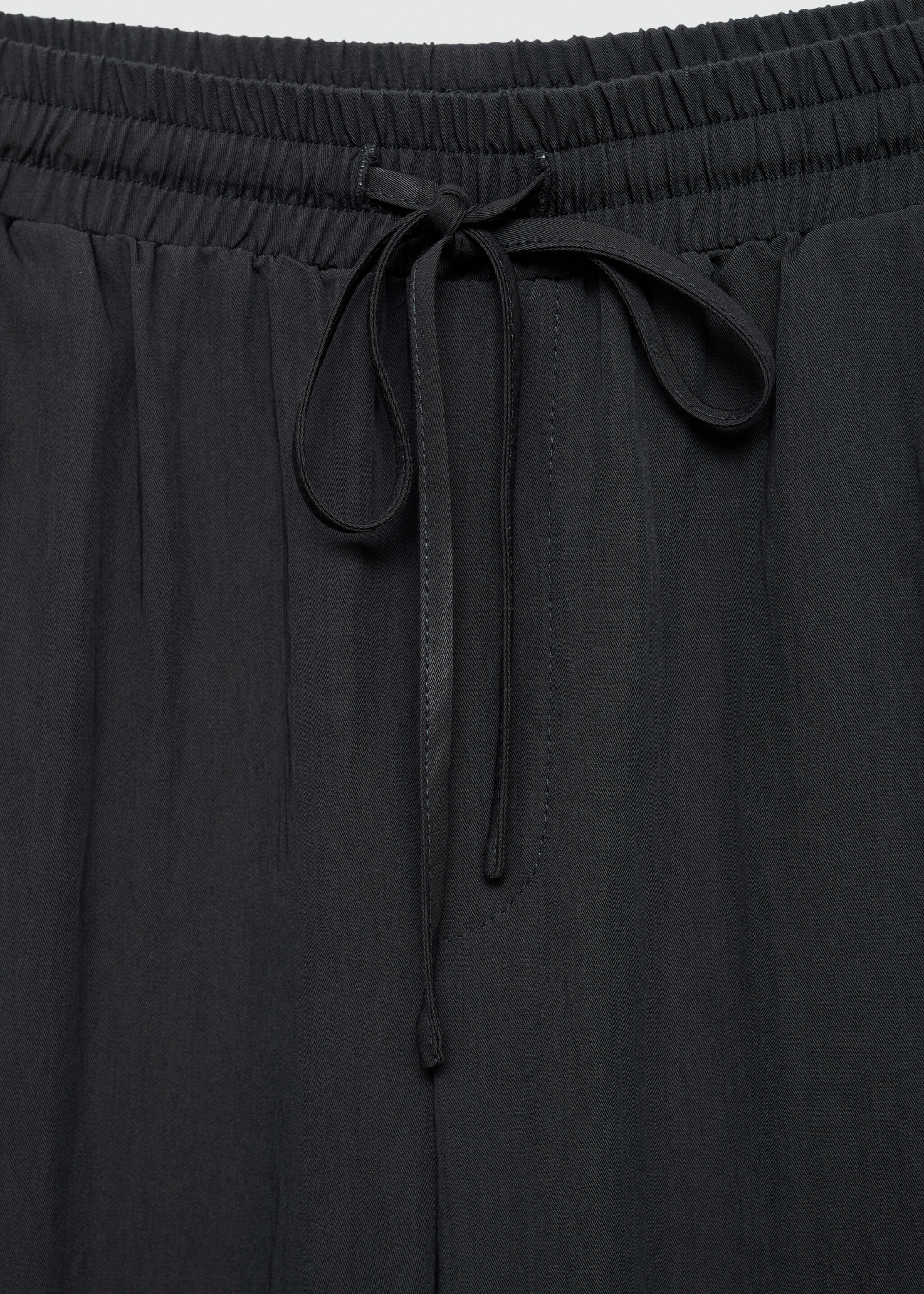 Flowy trousers - Details of the article 8, Charcoal. Ref: 77064787-00.
