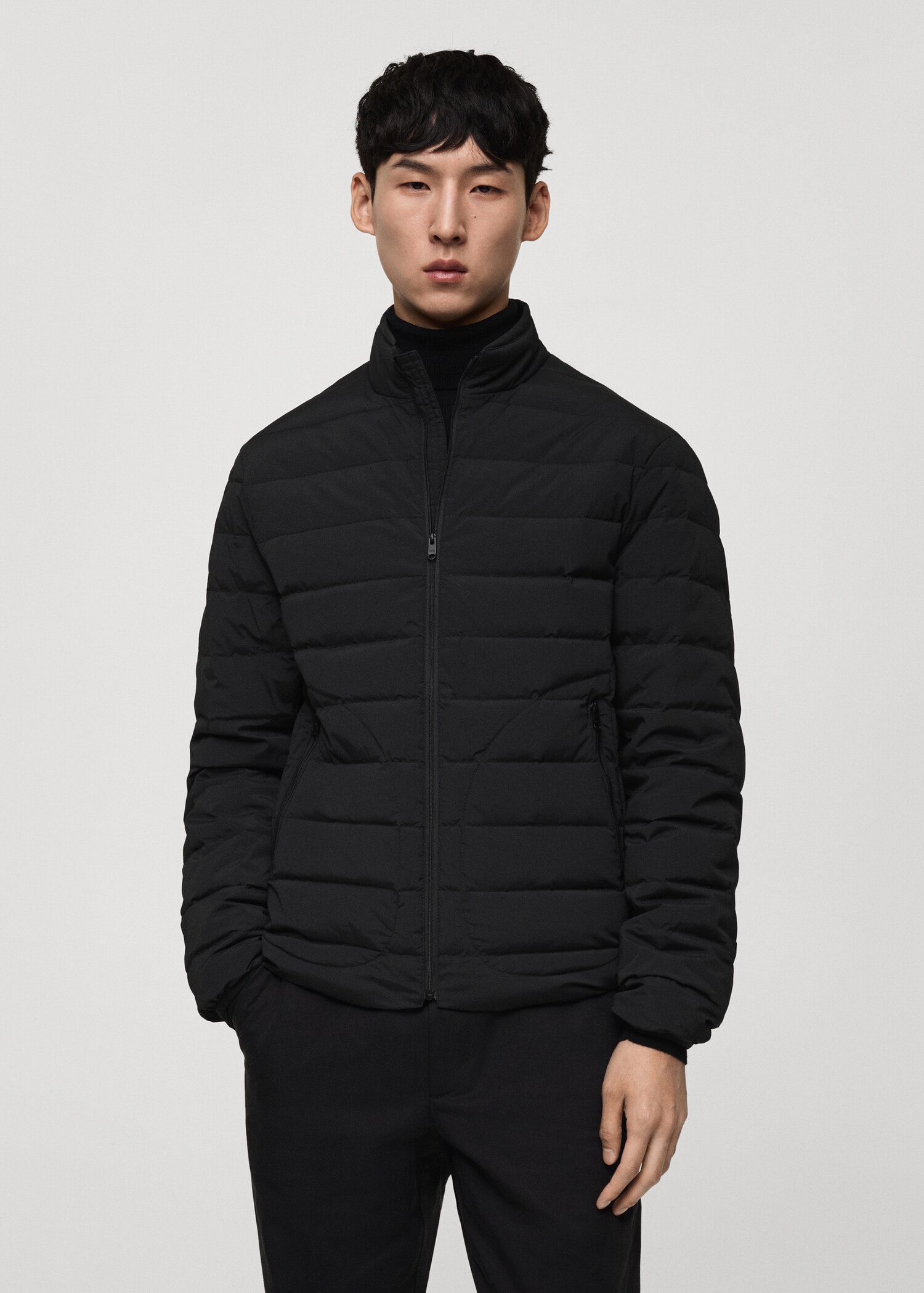 Quilted jacket with feather filling - Medium plane