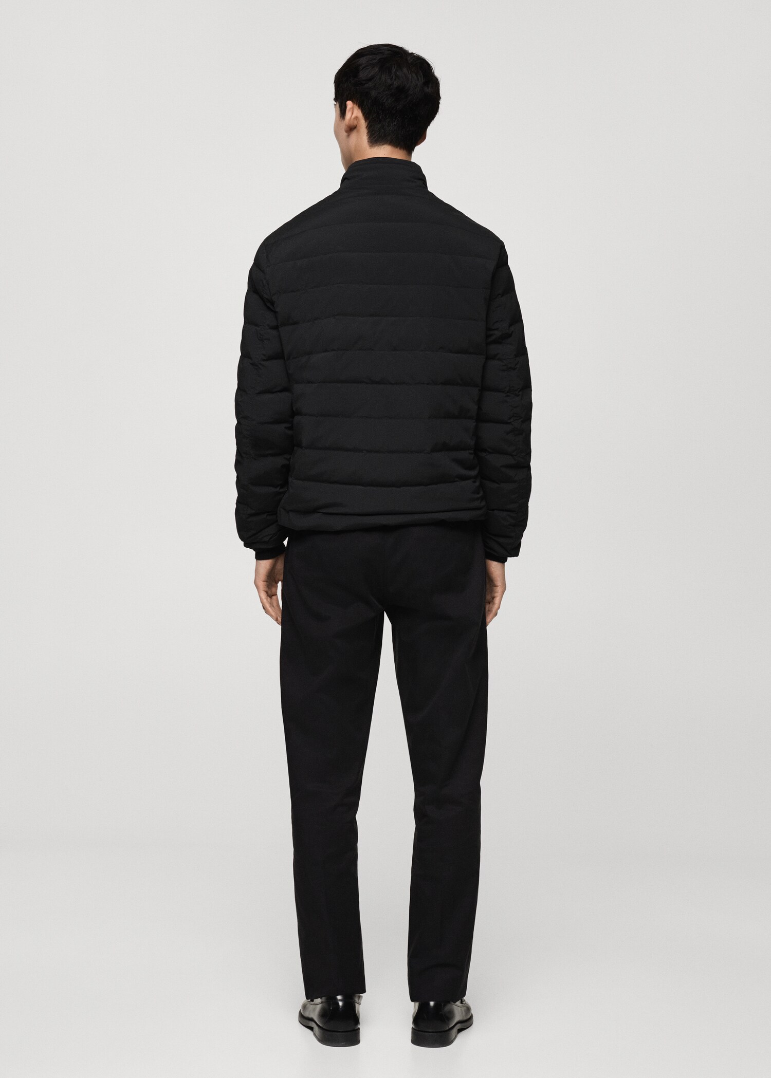 Quilted jacket with feather filling - Reverse of the article
