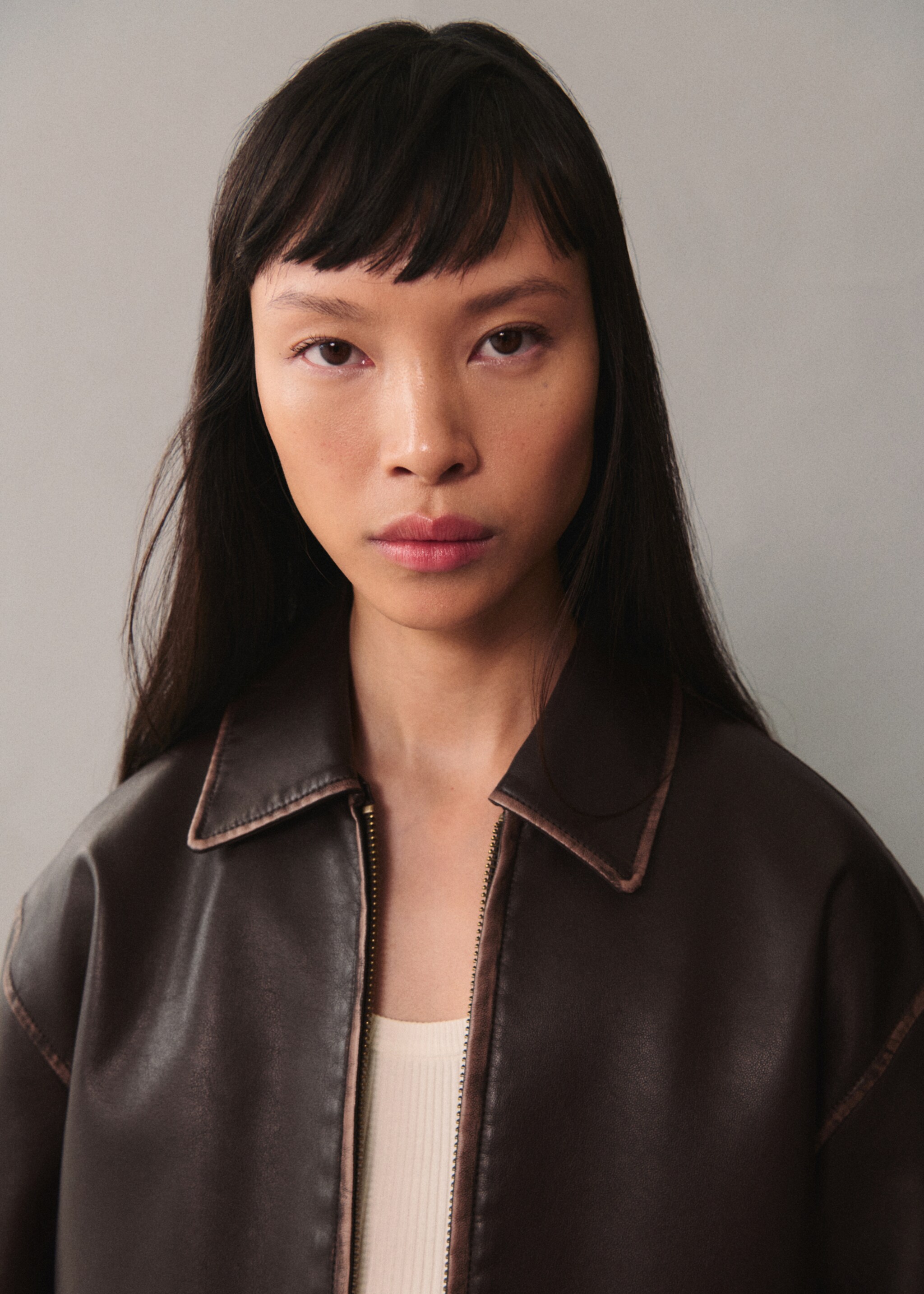 Leather-effect jacket with contrast stitching - Details of the article 1, Brown. Ref: 77076004-00.