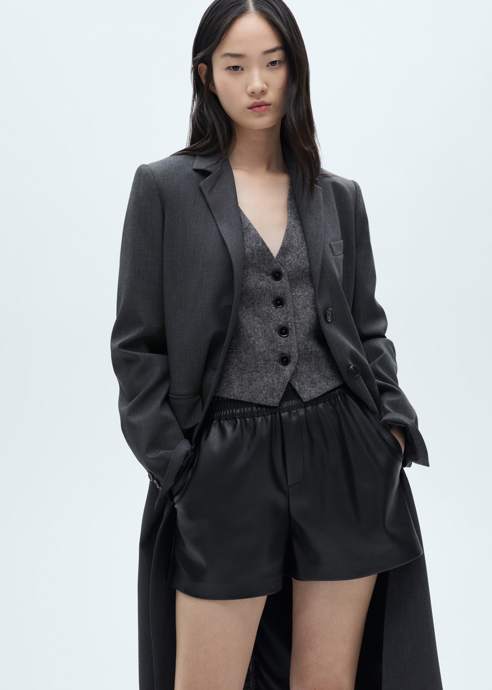 Leather-effect shorts with elastic waist - Details of the article 1, Black. Ref: 77077117-00.