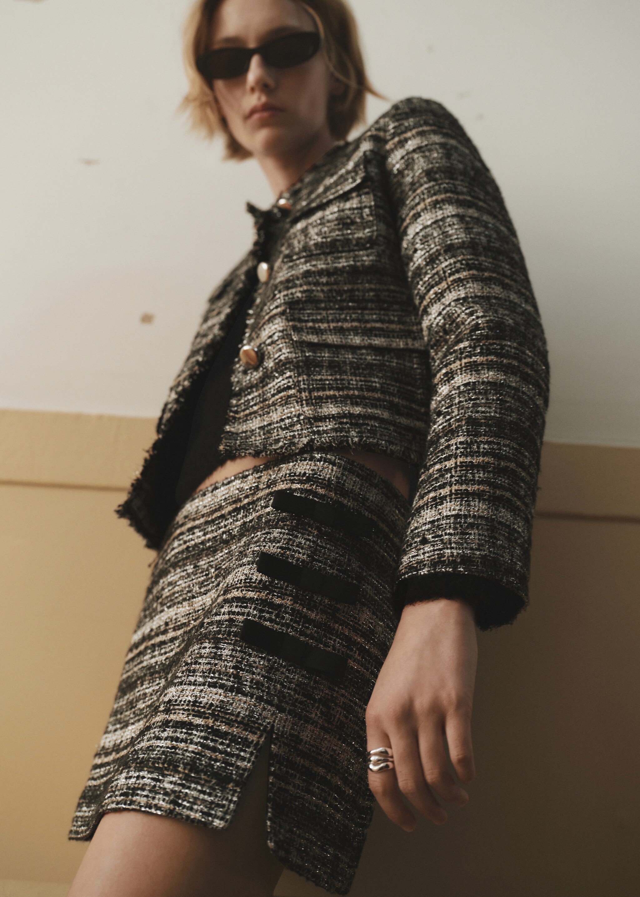 Tweed mini-skirt with bows - Details of the article 7, Black. Ref: 77079245-00.