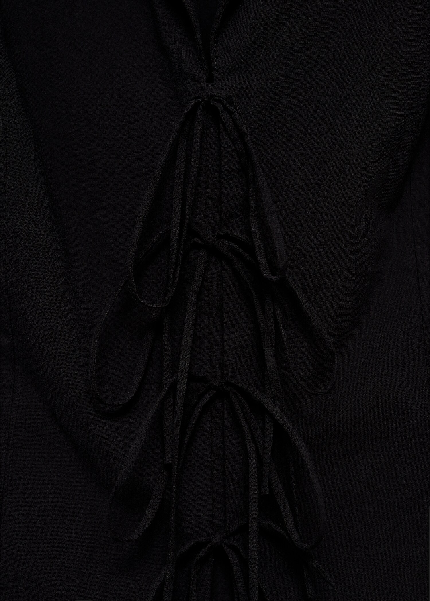 Sleeveless blouse with bows - Details of the article 0