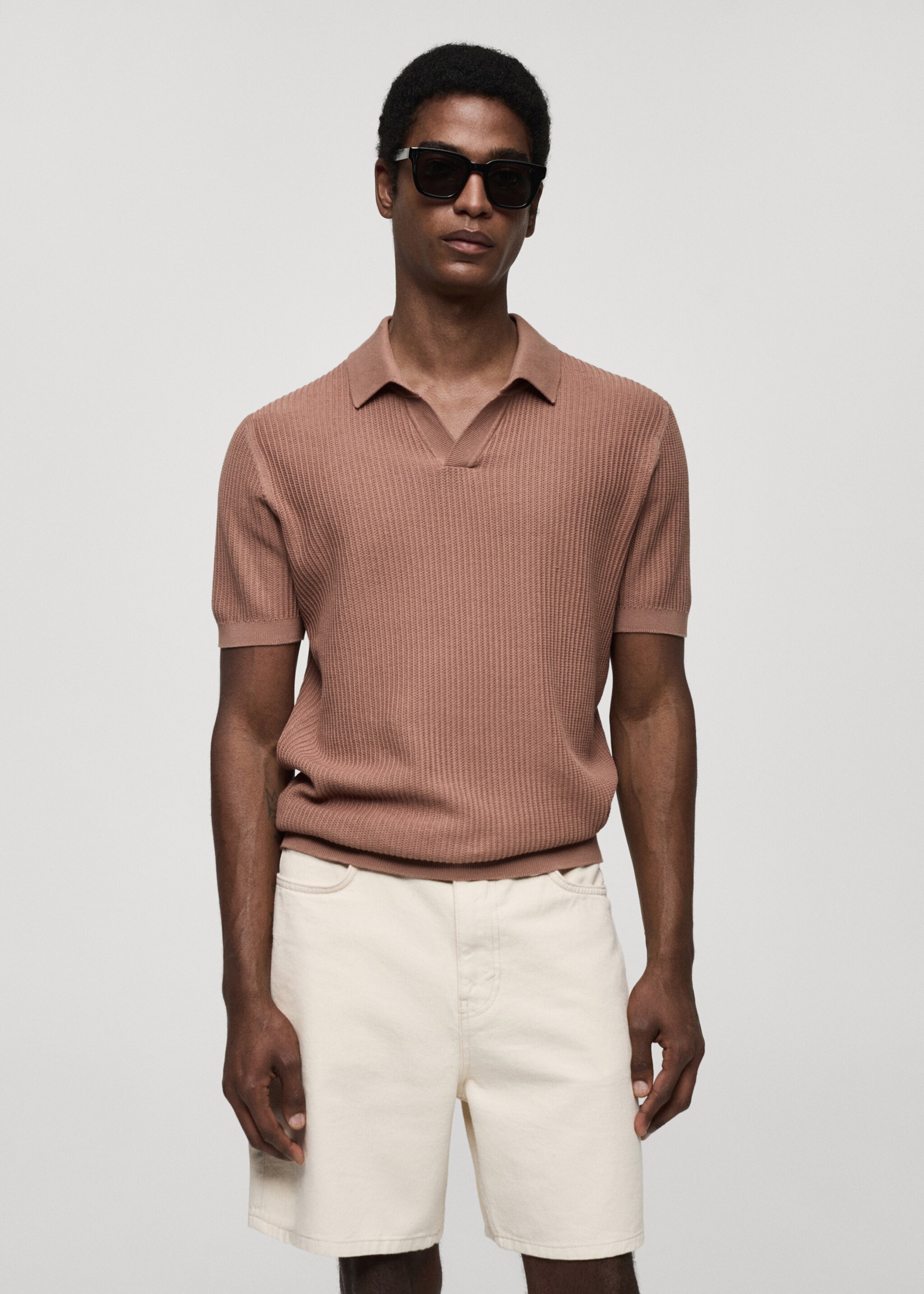 Geripptes Strick-Poloshirt aus Baumwolle - Mittlere Ansicht
