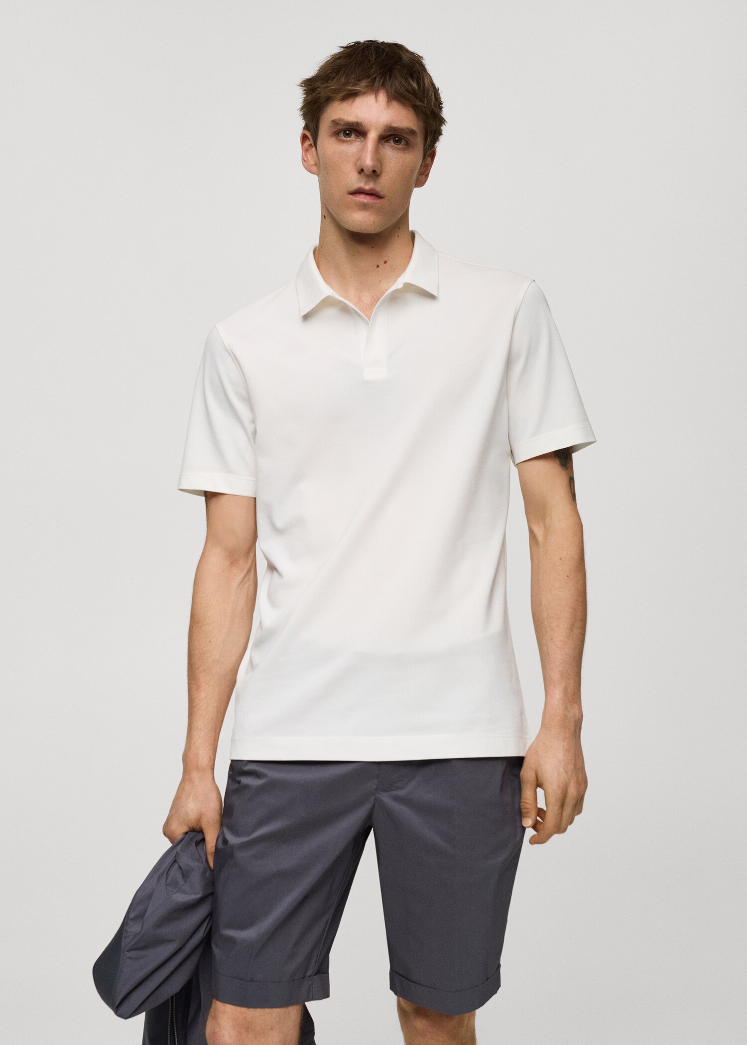 Slim Fit-Poloshirt aus Baumwoll-Piqué - Mittlere Ansicht