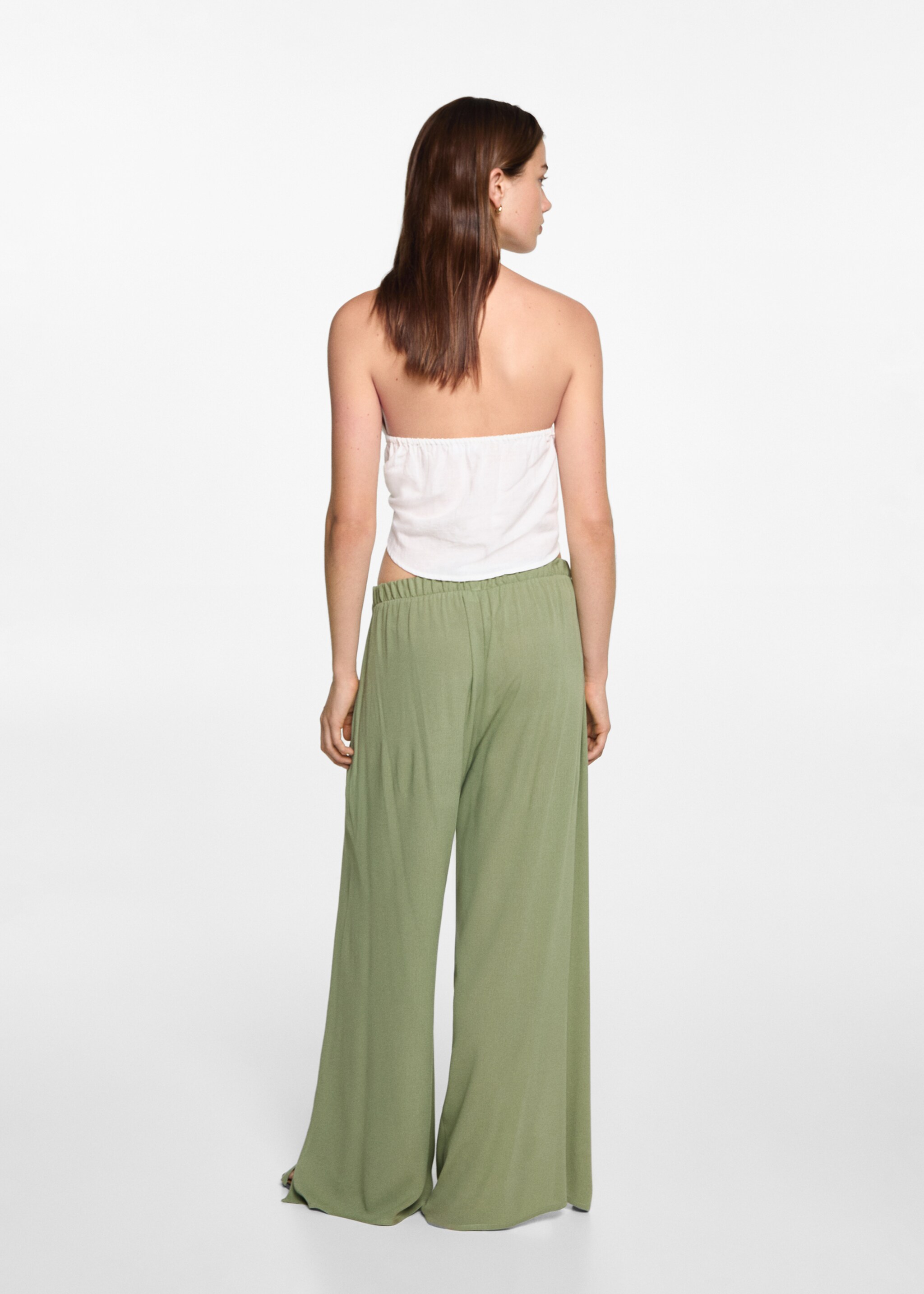 Palazzo trousers with openings - Reverse of the article