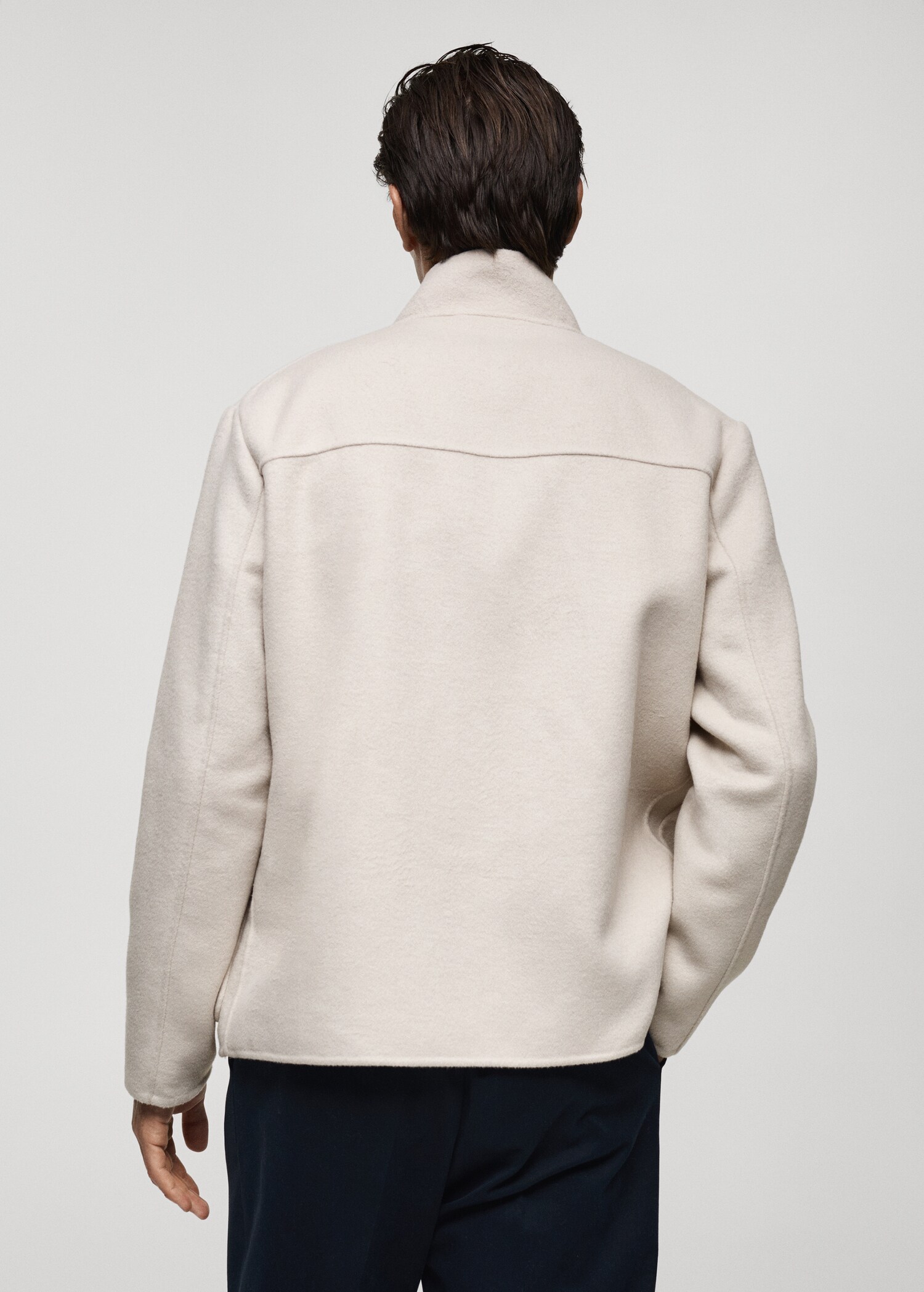 Handmade wool jacket with funnel neck - Reverse of the article