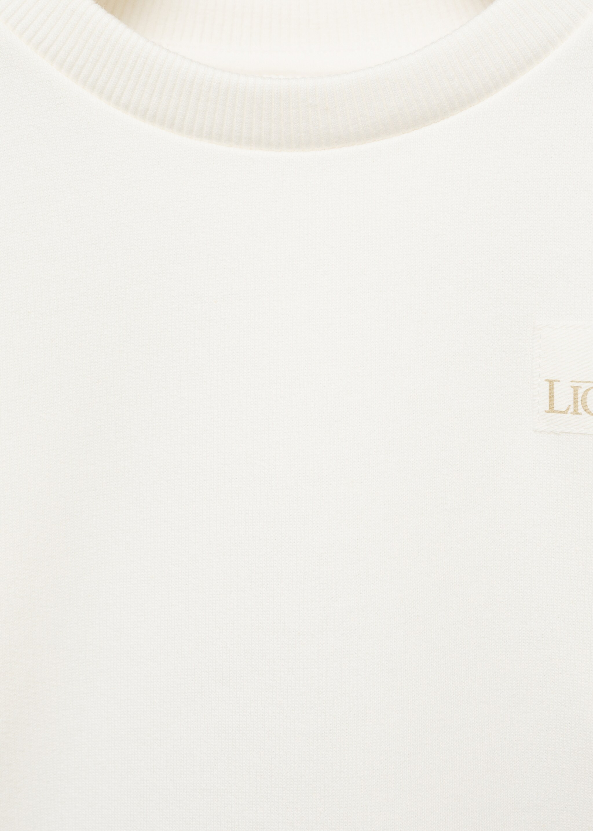 Dessuadora Rei Lleó - Detall de l'article 8, Blanc trencat. Ref: 87000643-00.