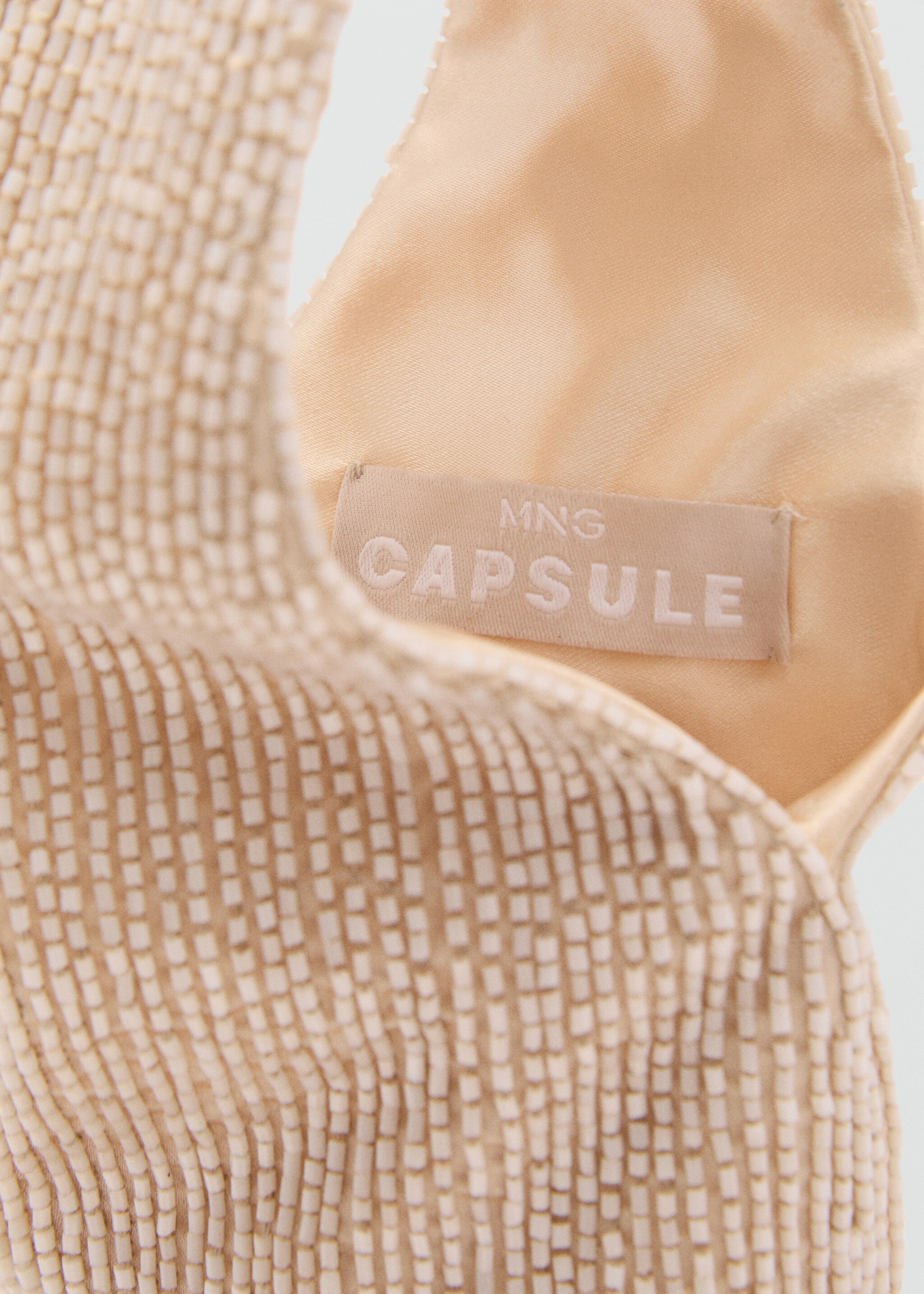 Bossa mà brodada pedreria - Detall de l'article 4, Gris clar/pastel. Ref: 87015753-00.