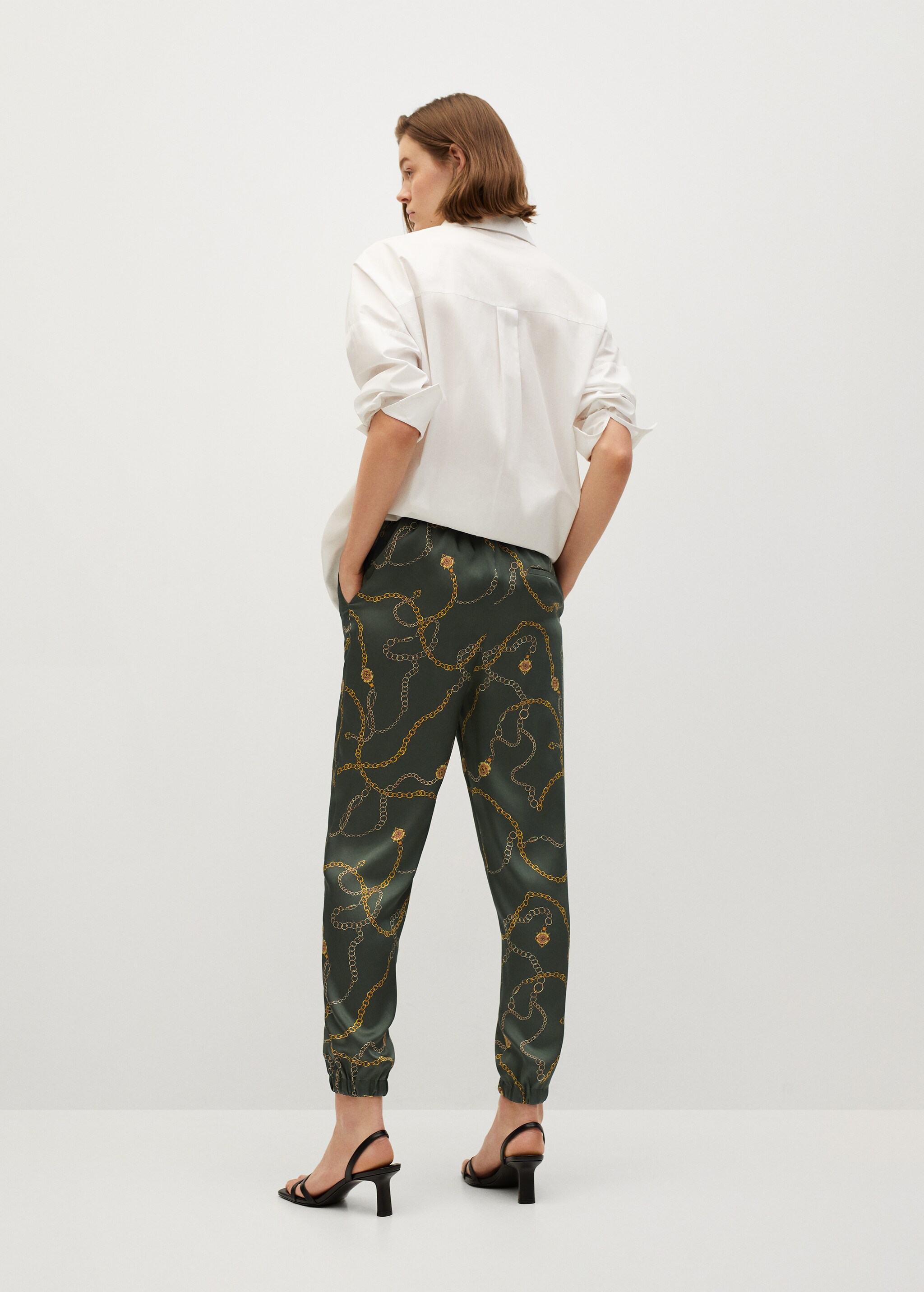 Satin-finish trousers with pleat detail  - Reverse of the article