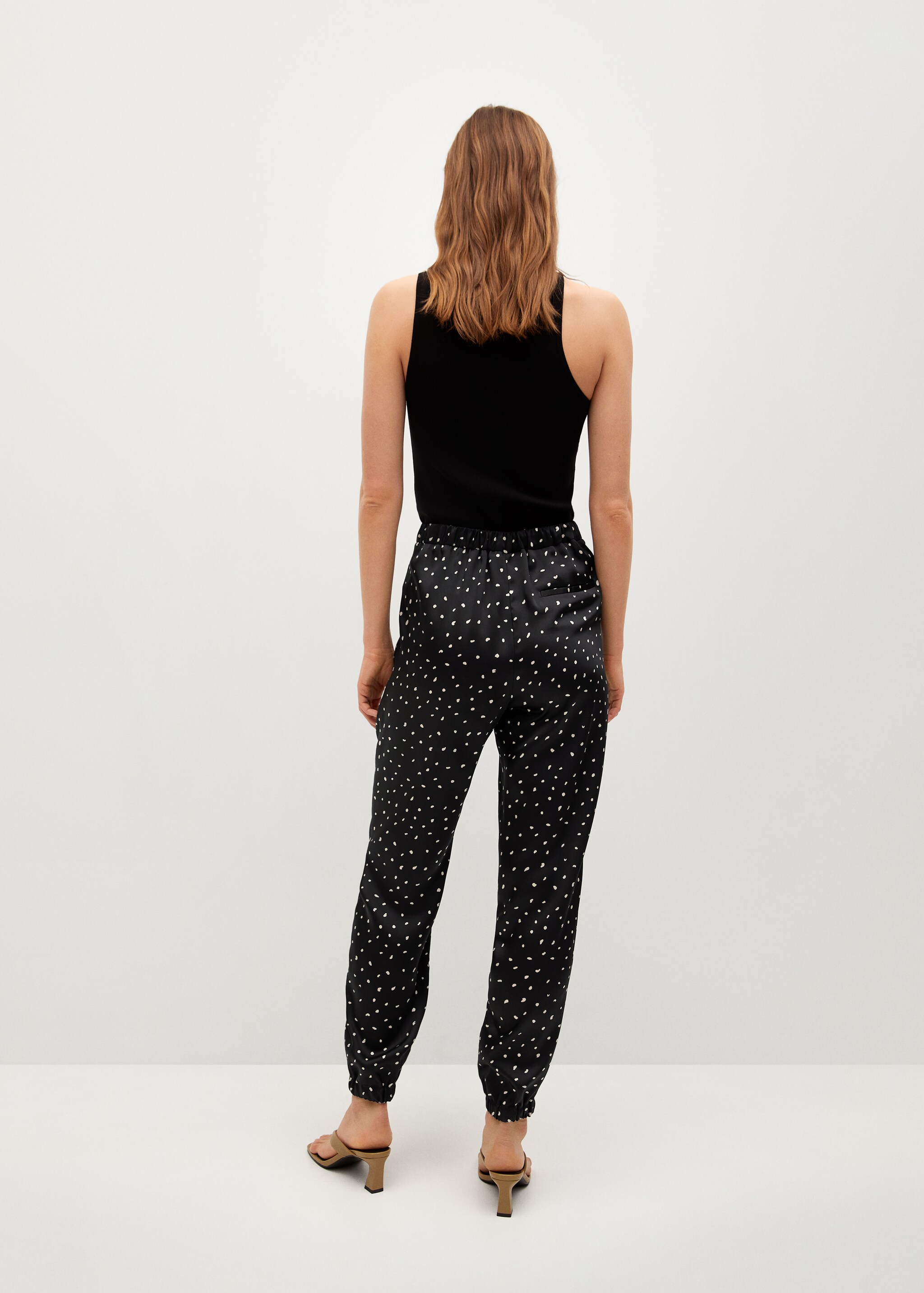 Satin-finish trousers with pleat detail  - Reverse of the article