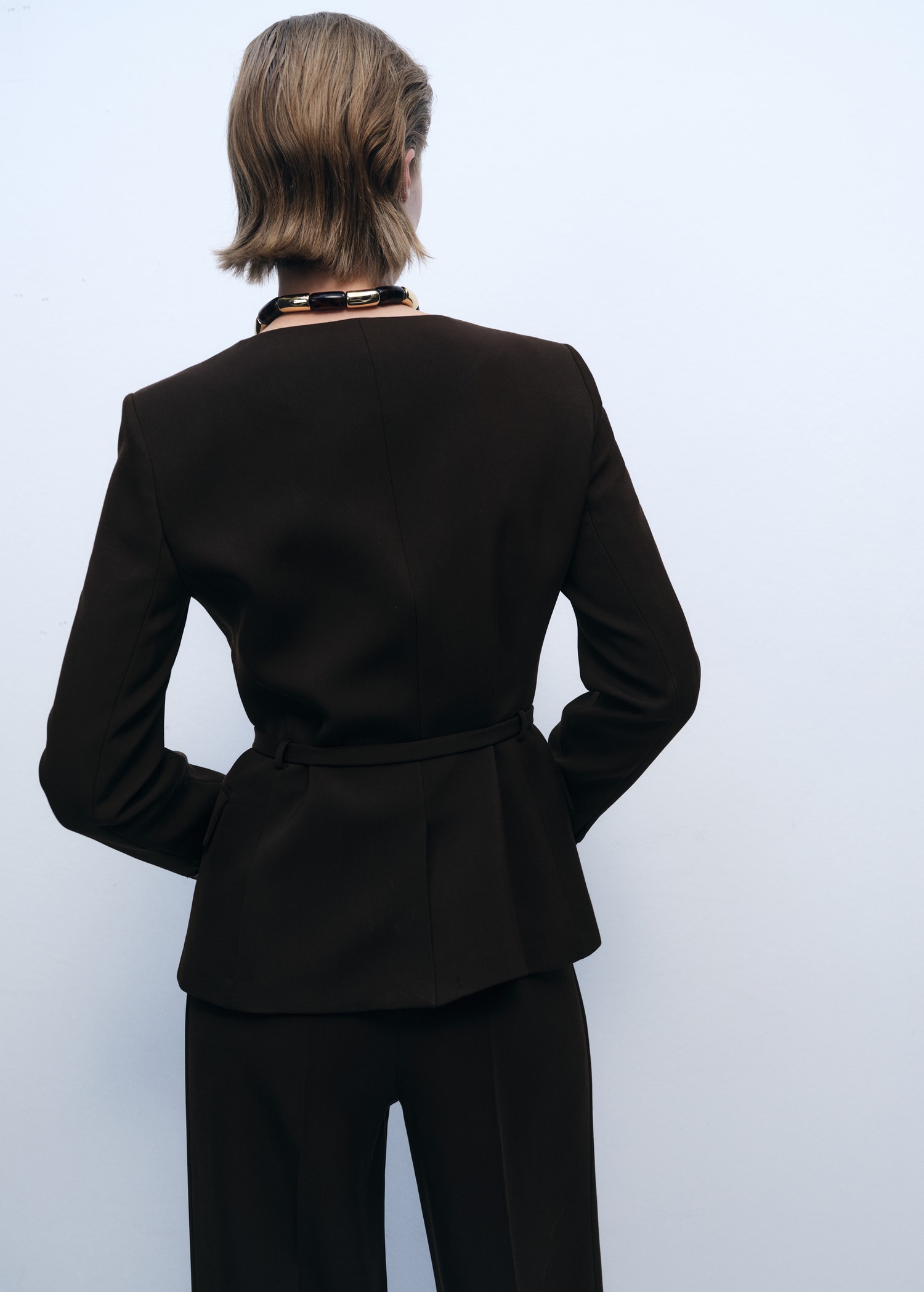 Suit jacket with belt - Reverse of the article