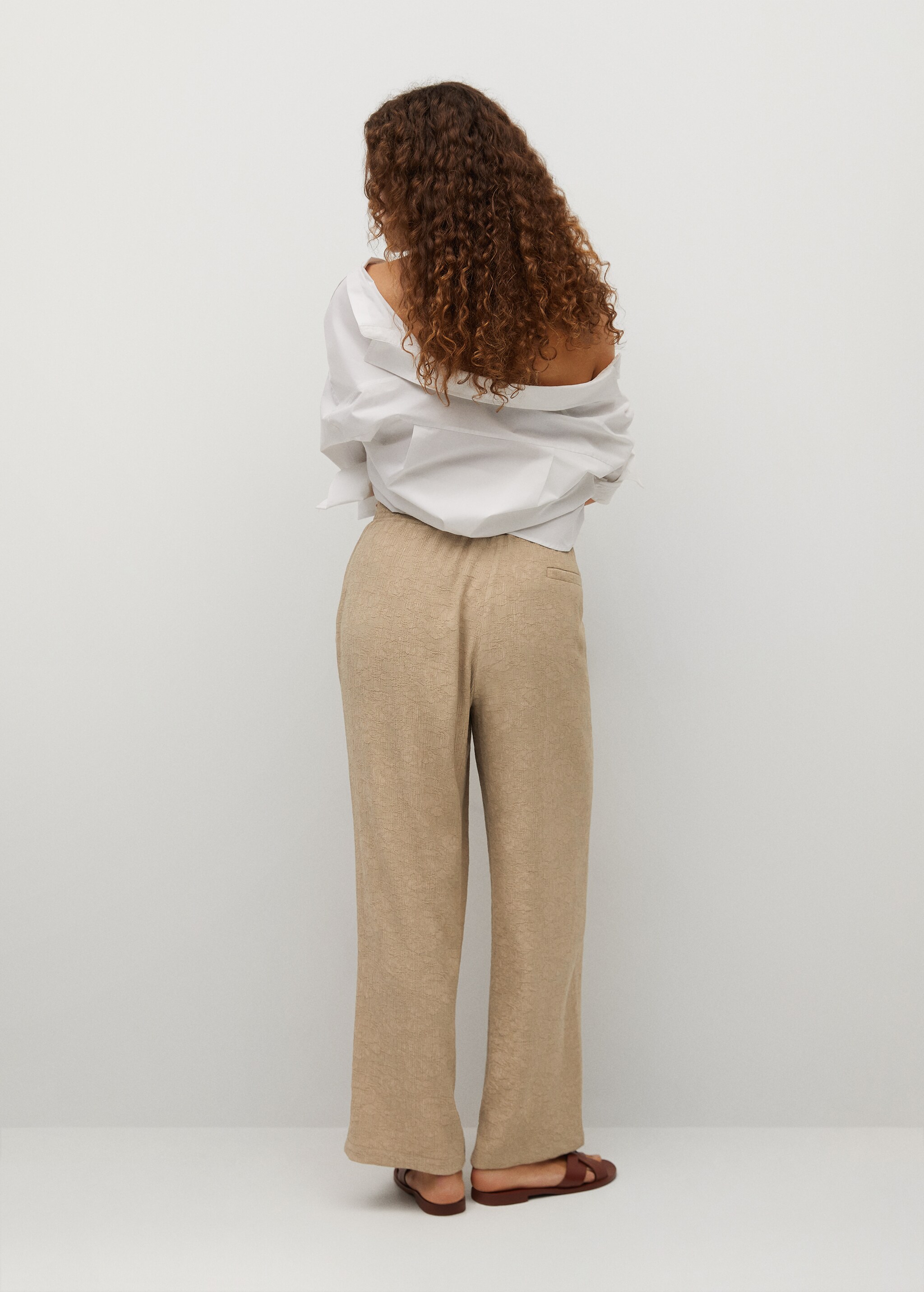 Textured flowy trousers - Reverse of the article