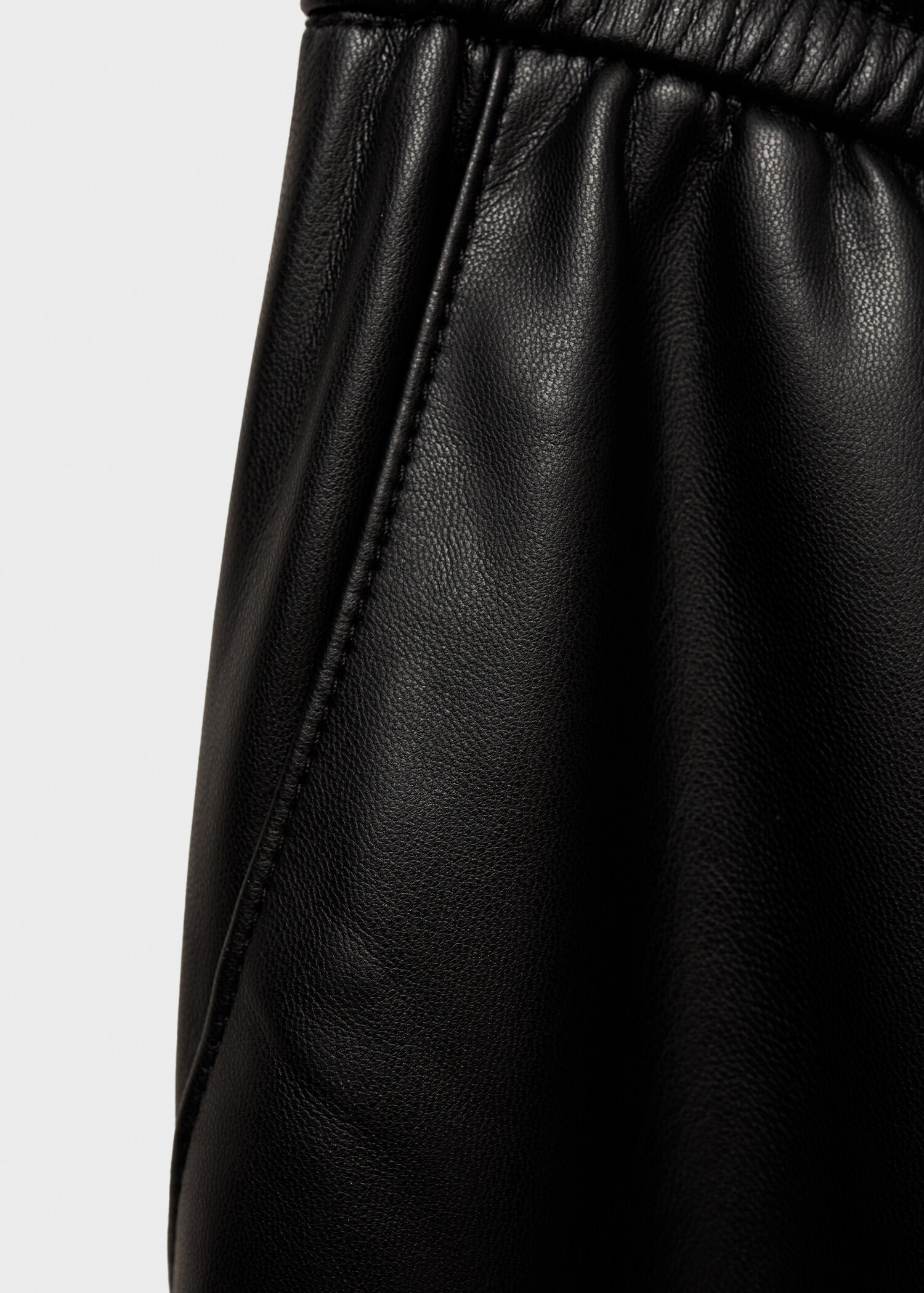 Faux-leather trousers with elastic waist - Details of the article 0