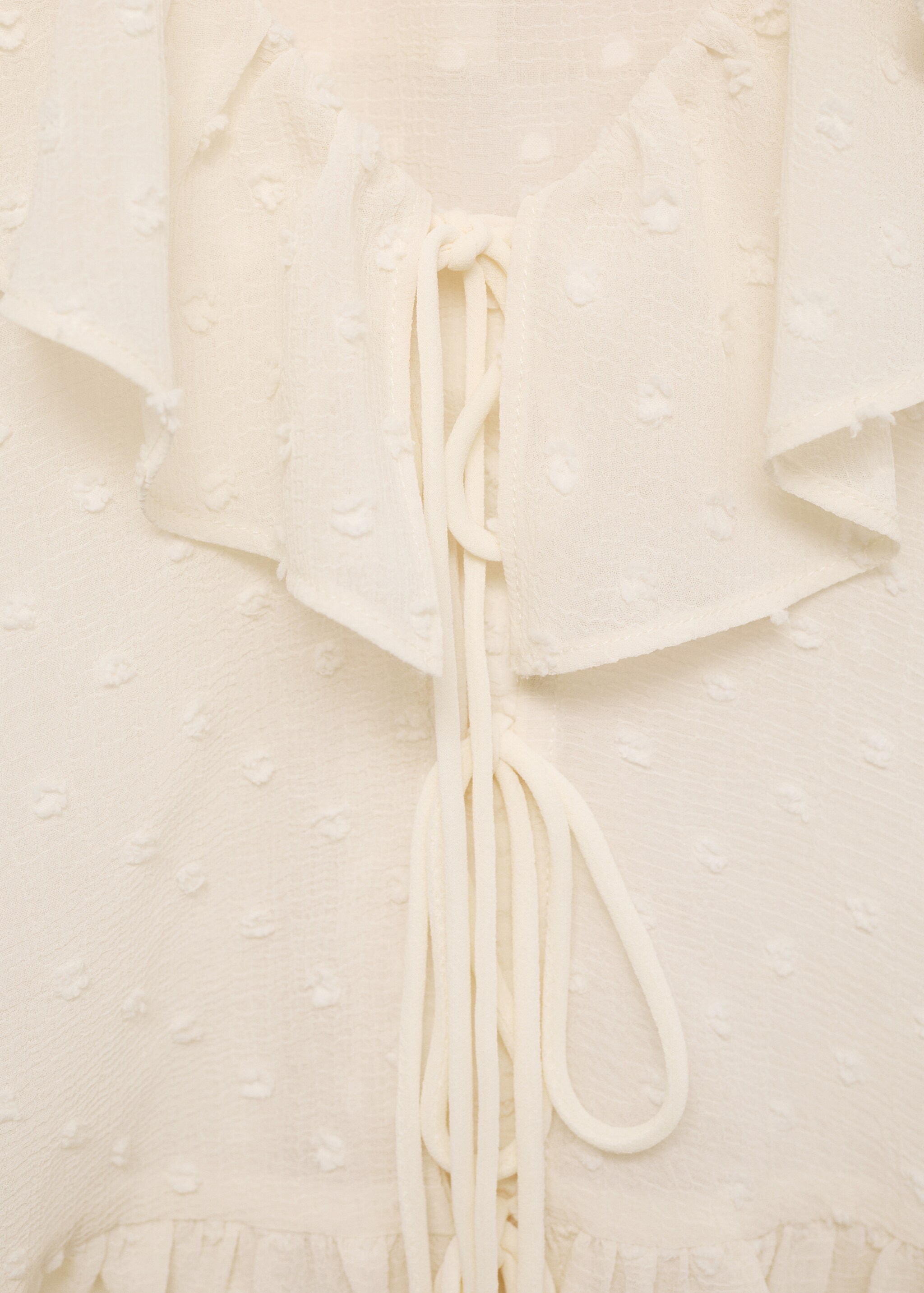 Ruffled blouse with bow closure - Details of the article 8, Ecru. Ref: 87034074-00.