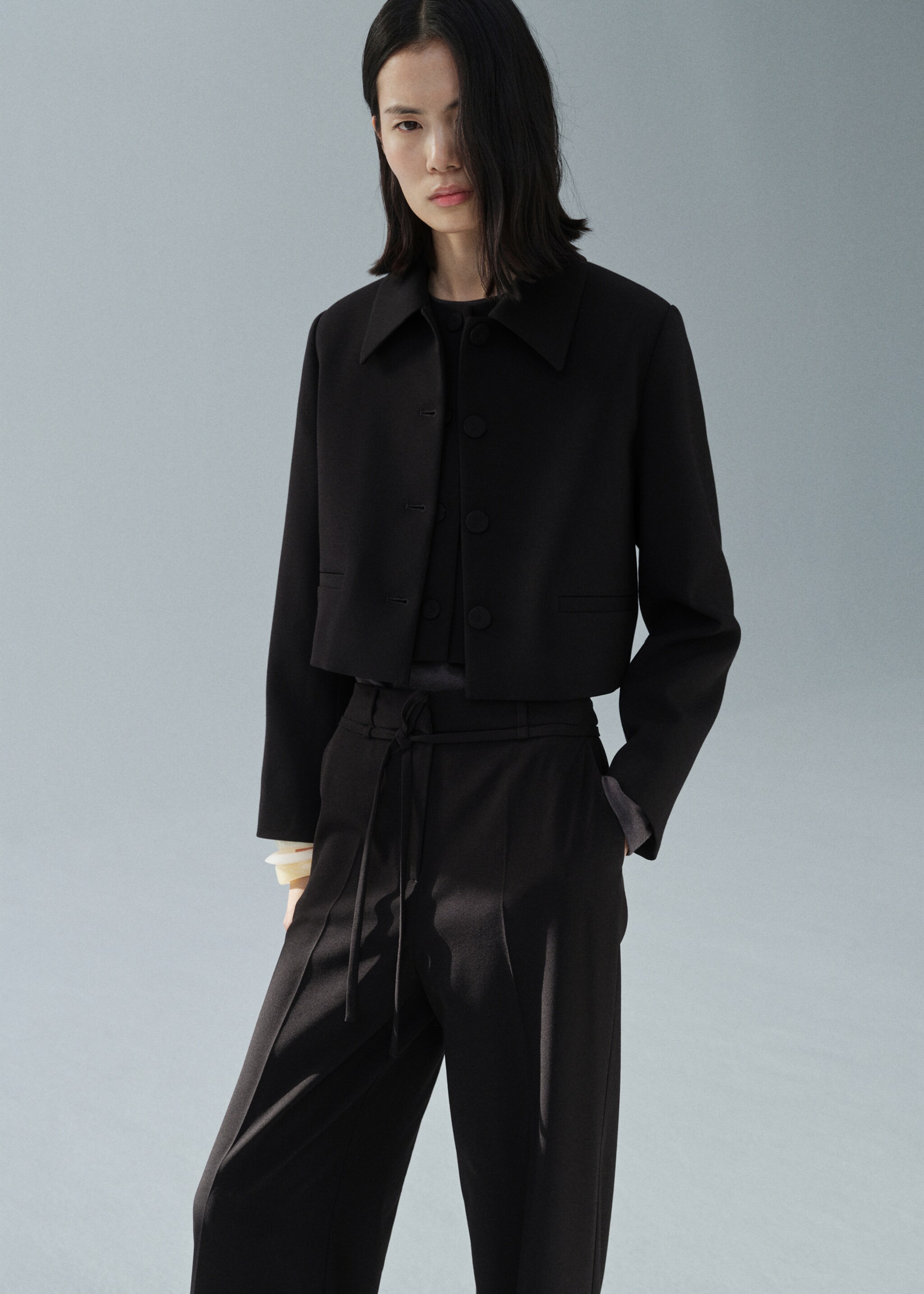 Straight suit trousers with bow - Details of the article 1, Black. Ref: 87034803-00.
