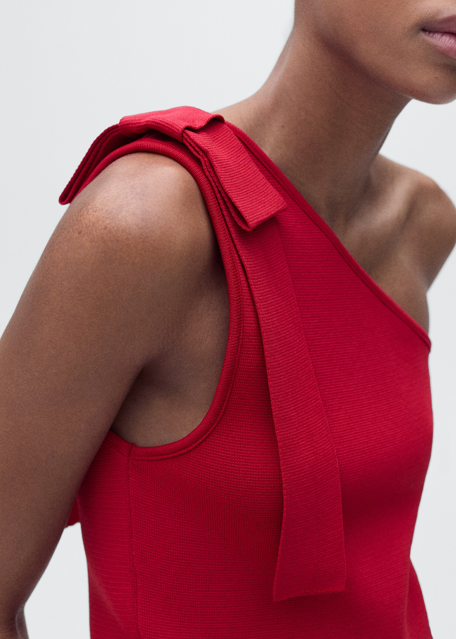 Asymmetrical knitted top with bow - Details of the article 1