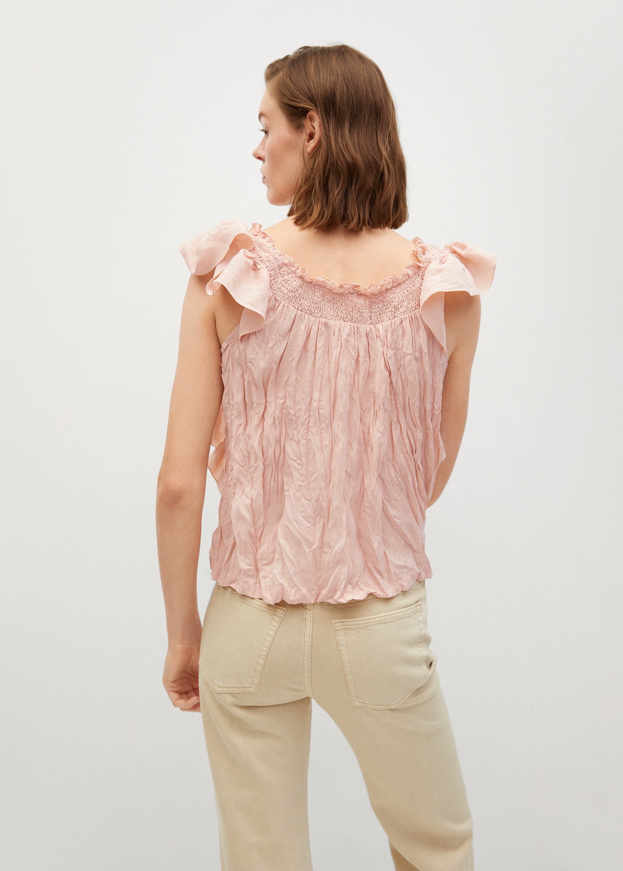 Blusa textura volantes - Reverso del artículo
