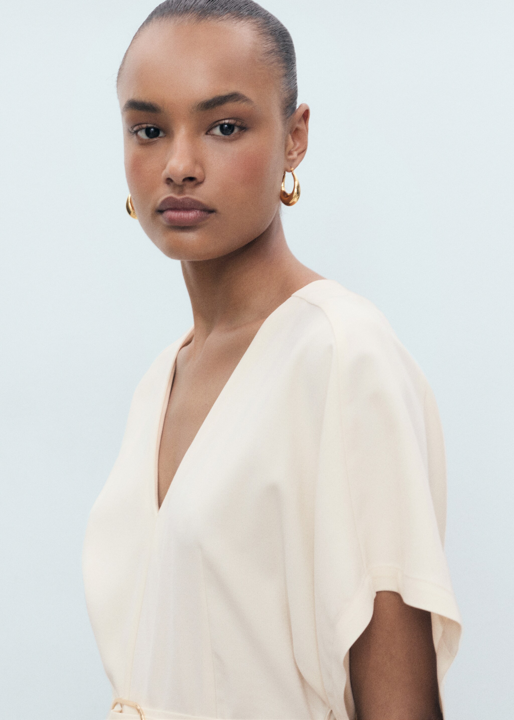 Long jumpsuit with belt and buckle - Details of the article 1, Ecru. Ref: 87055754-00.