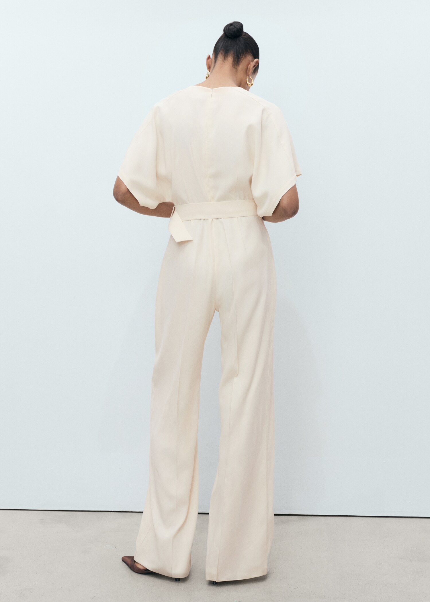 Long jumpsuit with belt and buckle - Reverse of the article