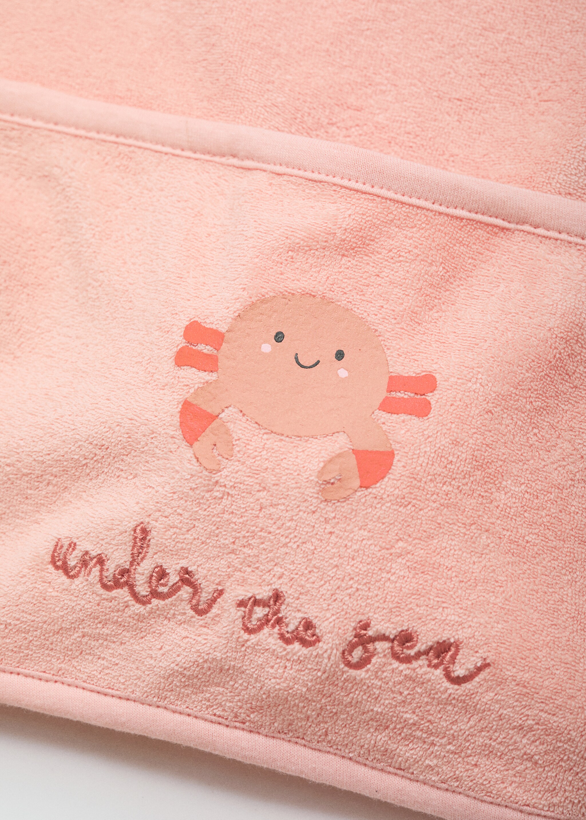 Terry cloth bib with embroidered details - Details of the article 1, Pastel Pink. Ref: 87056718-00.