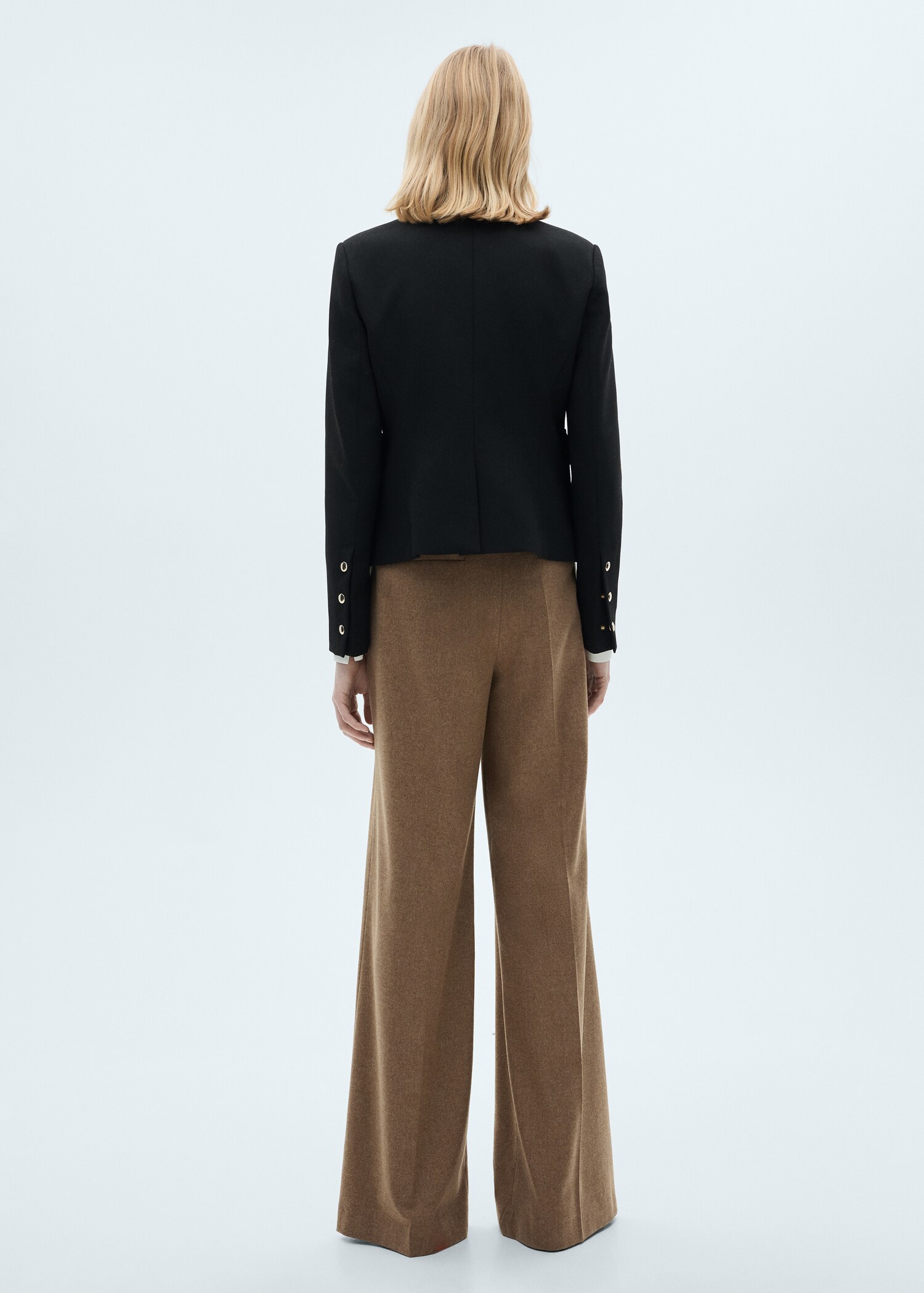 Jacket pockets with button detail - Reverse of the article