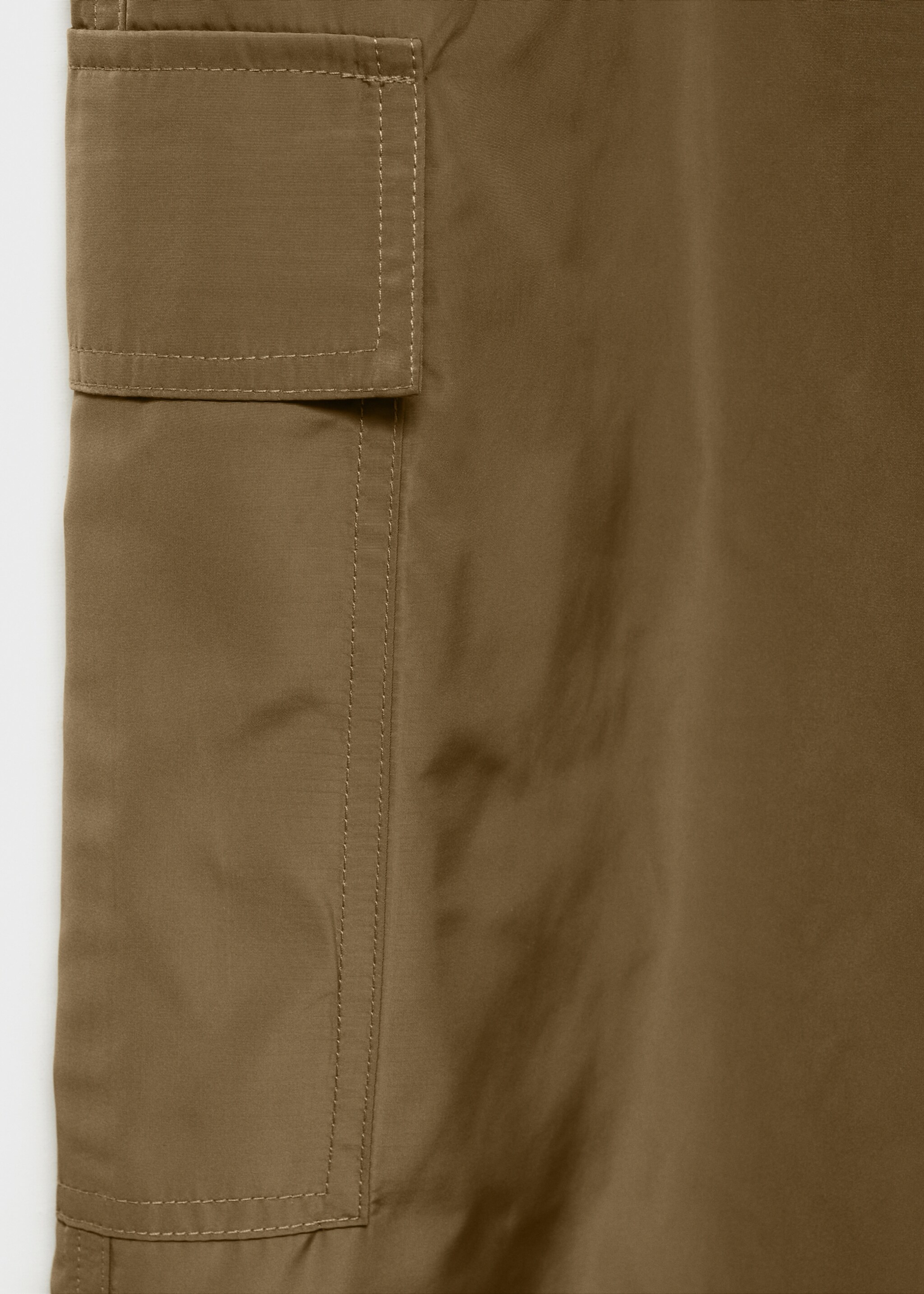Cargo trousers with adjustable hem - Details of the article 8, Khaki. Ref: 87064069-00.
