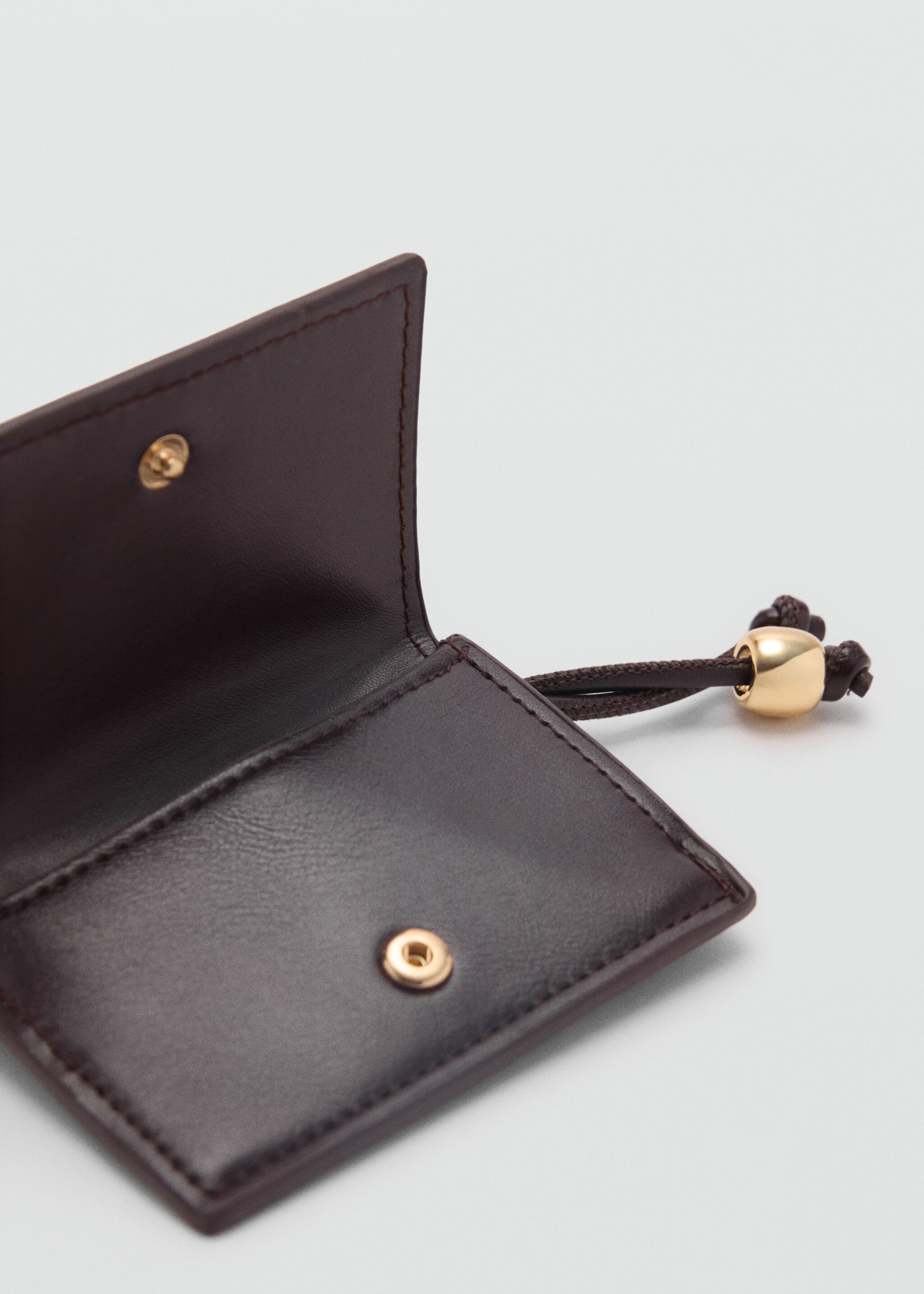 Faux-effect purse with bead detail - Details of the article 1, Chocolate. Ref: 87064809-00.