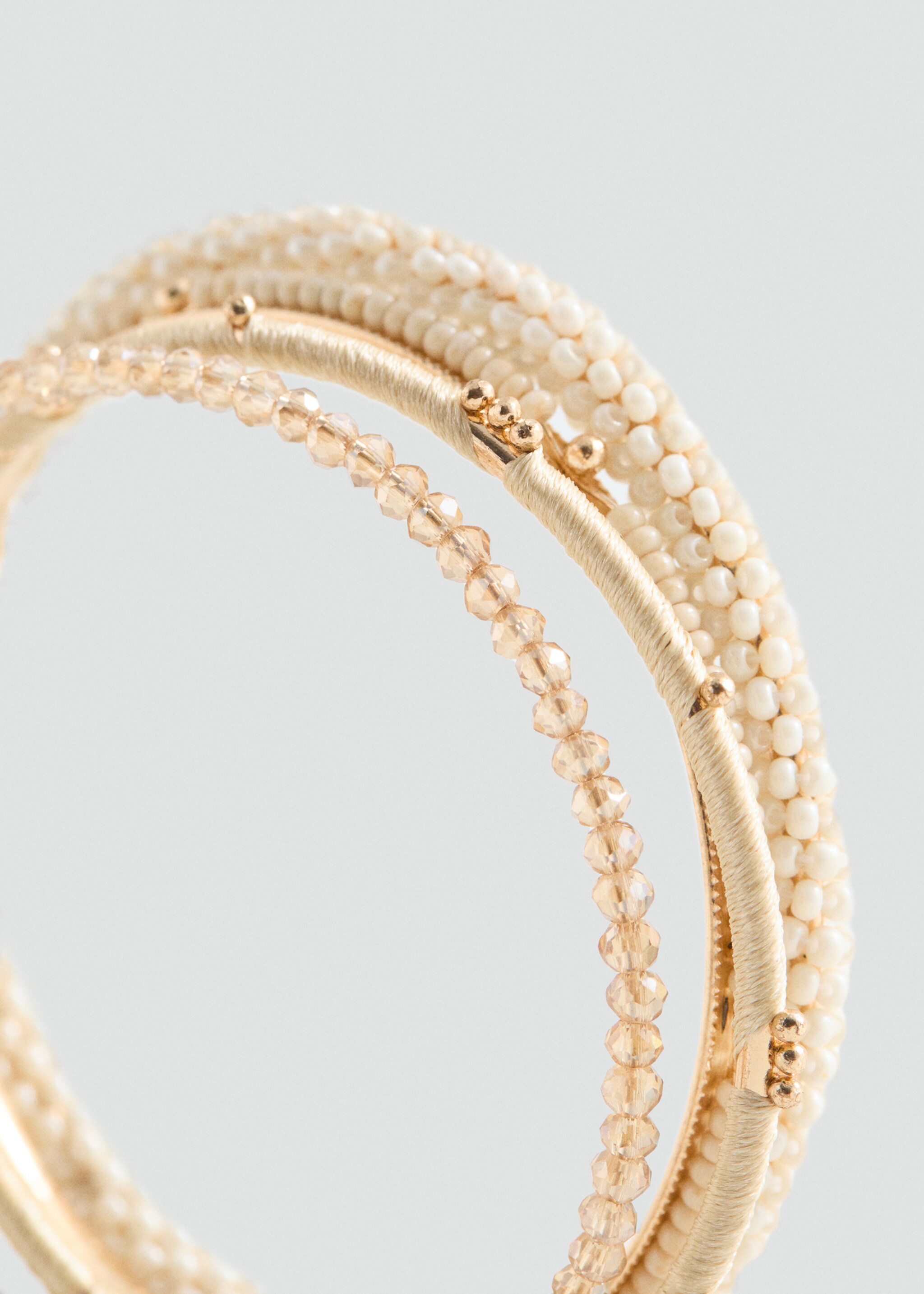 Tassel bracelet set - Details of the article 1, Sand. Ref: 87083647-00.