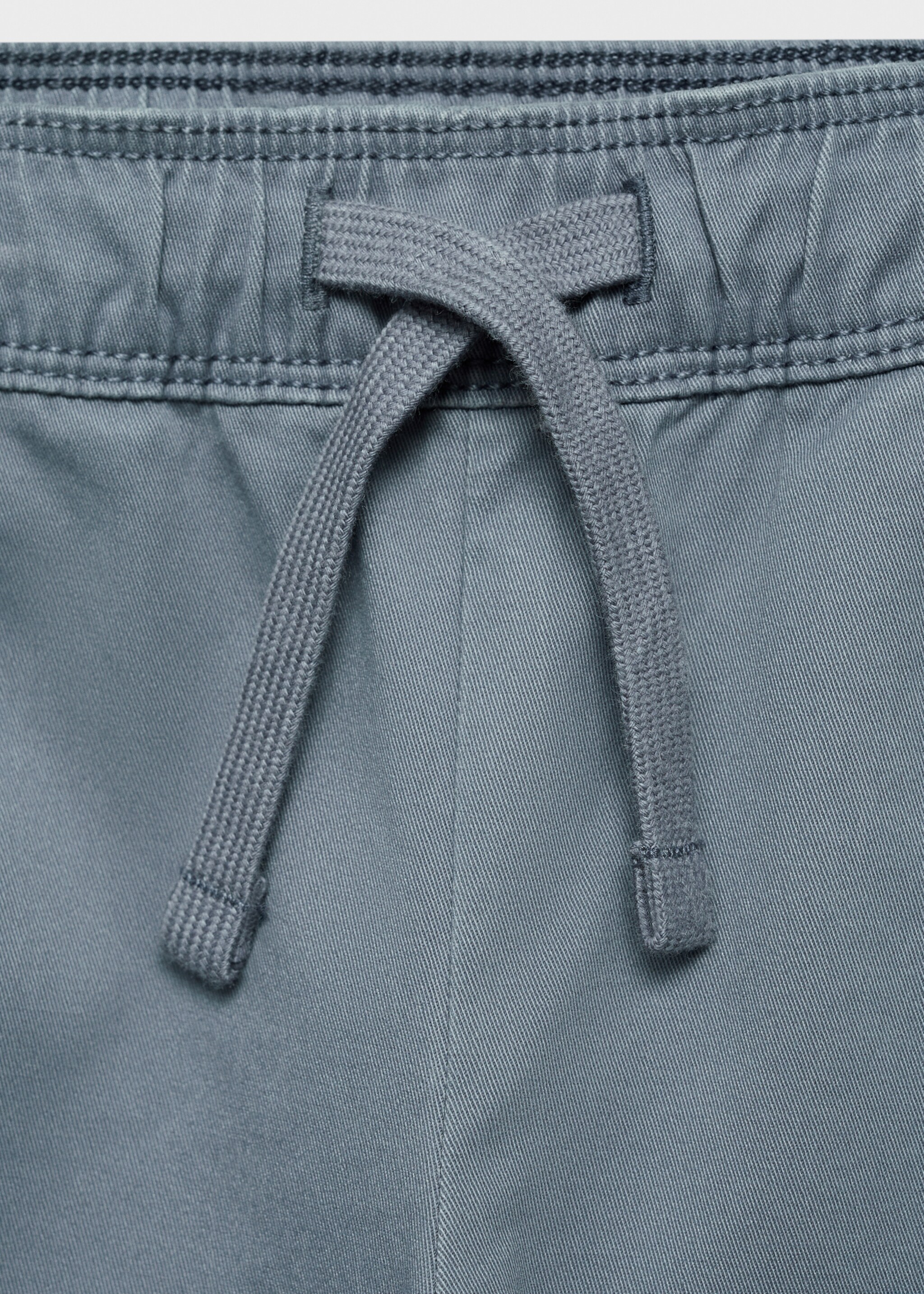 Cotton cargo trousers - Details of the article 8, China Blue. Ref: 87084781-00.