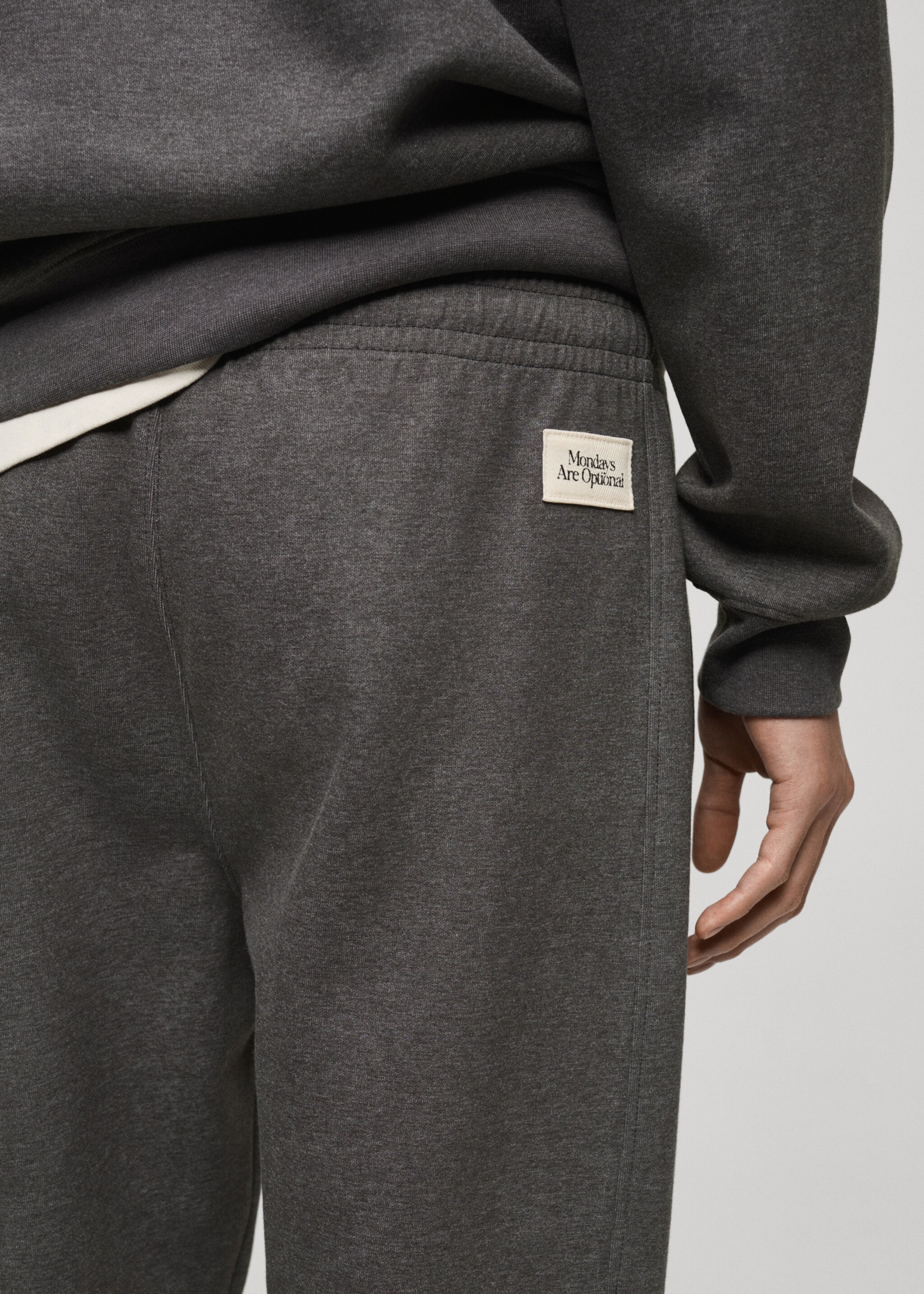 Cotton joggers embroidered detail - Details of the article 6, Medium Heather Grey. Ref: 87090642-00.